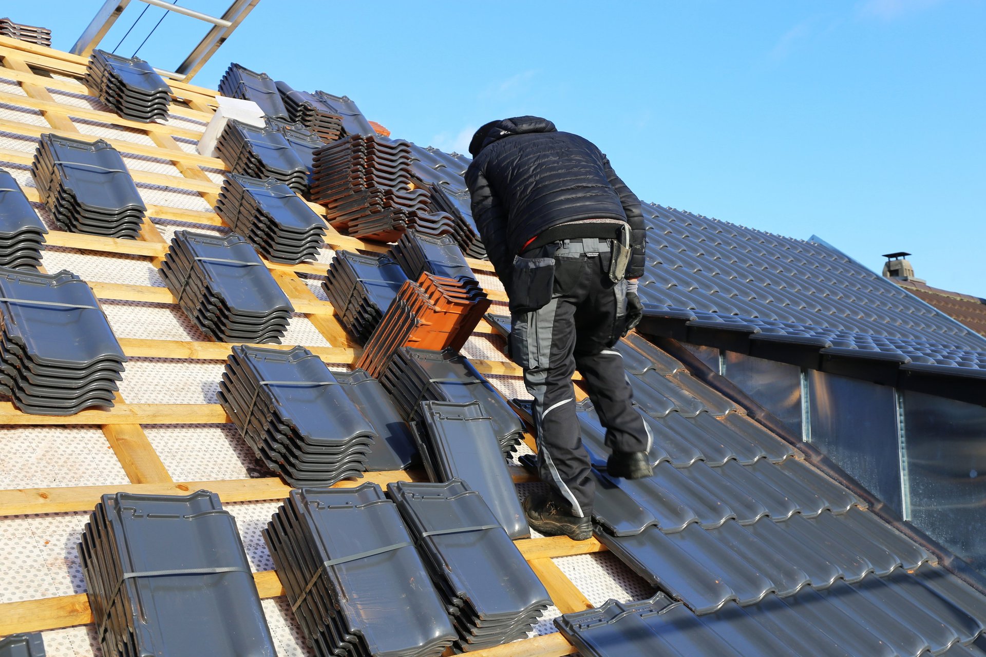 black and brown leather padded tub sofa