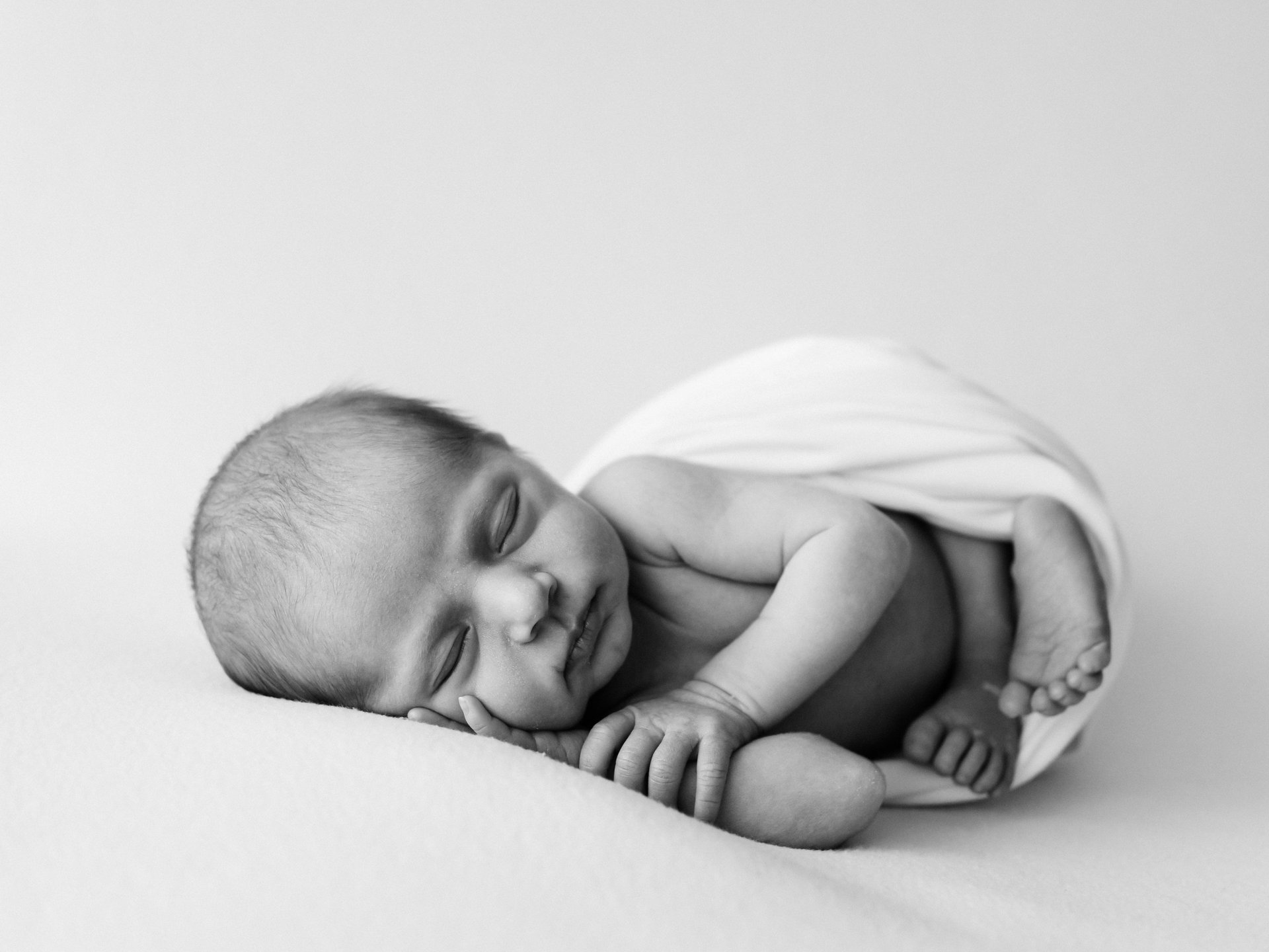 an abstract photo of a curved building with a blue sky in the background
