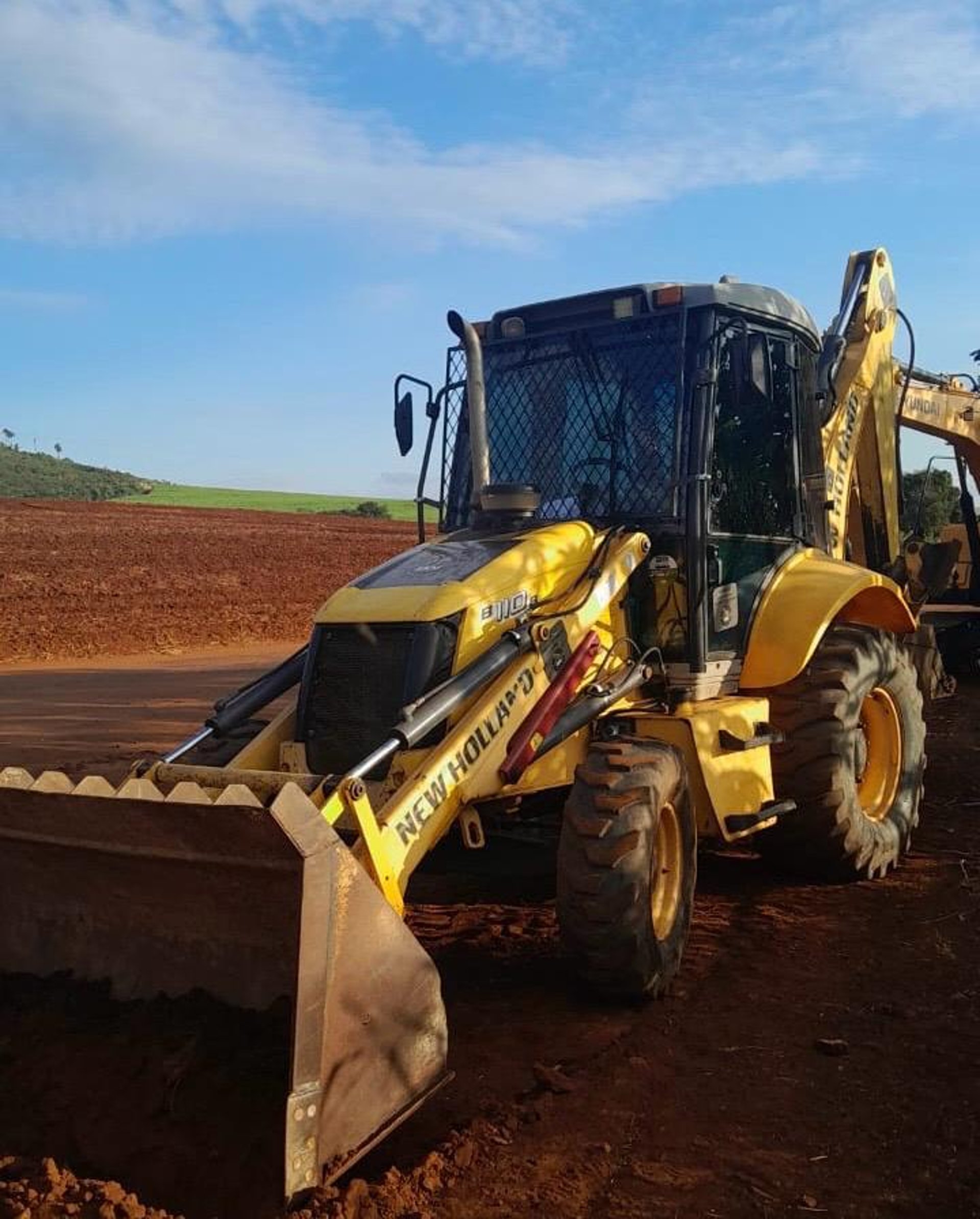 woman wearing yellow long-sleeved dress under white clouds and blue sky during daytime