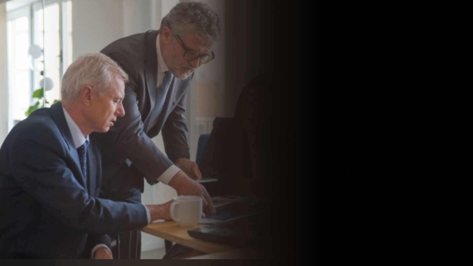 an abstract photo of a curved building with a blue sky in the background