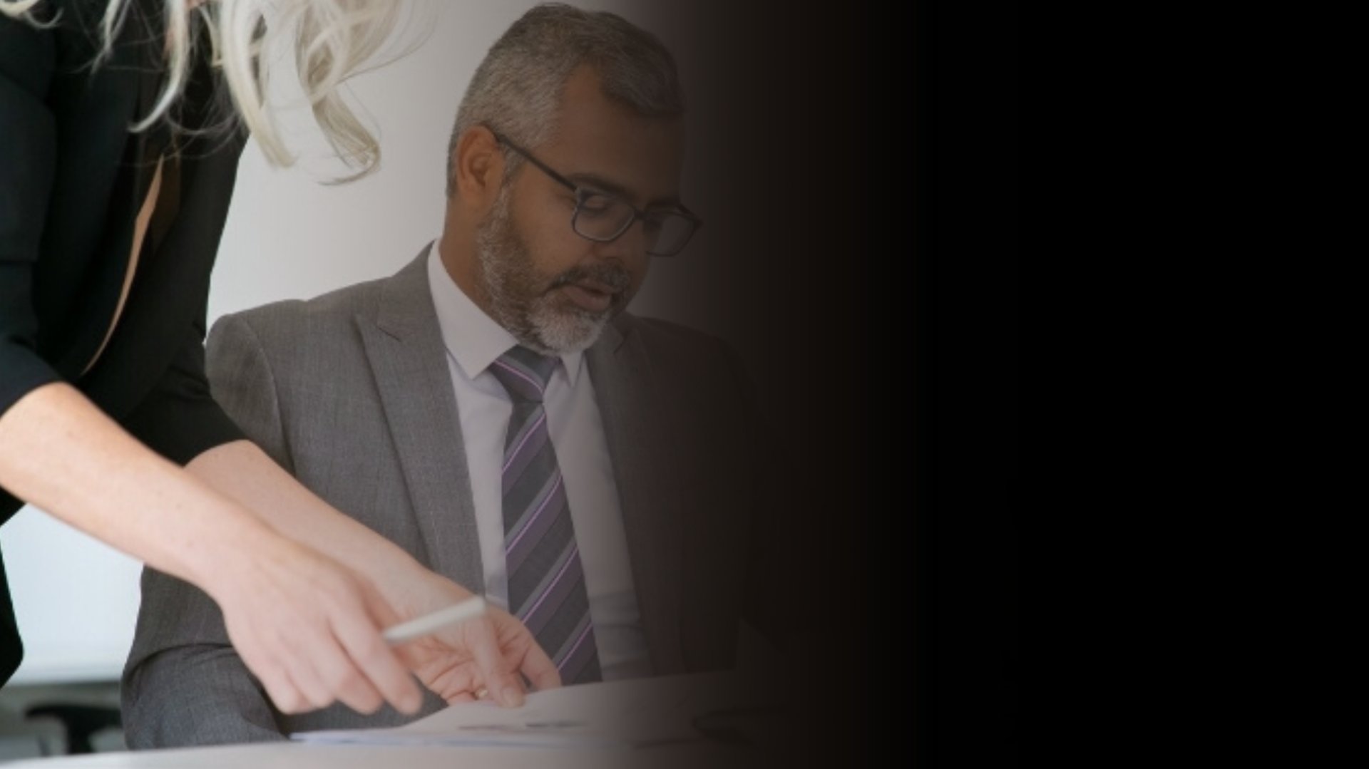 an abstract photo of a curved building with a blue sky in the background
