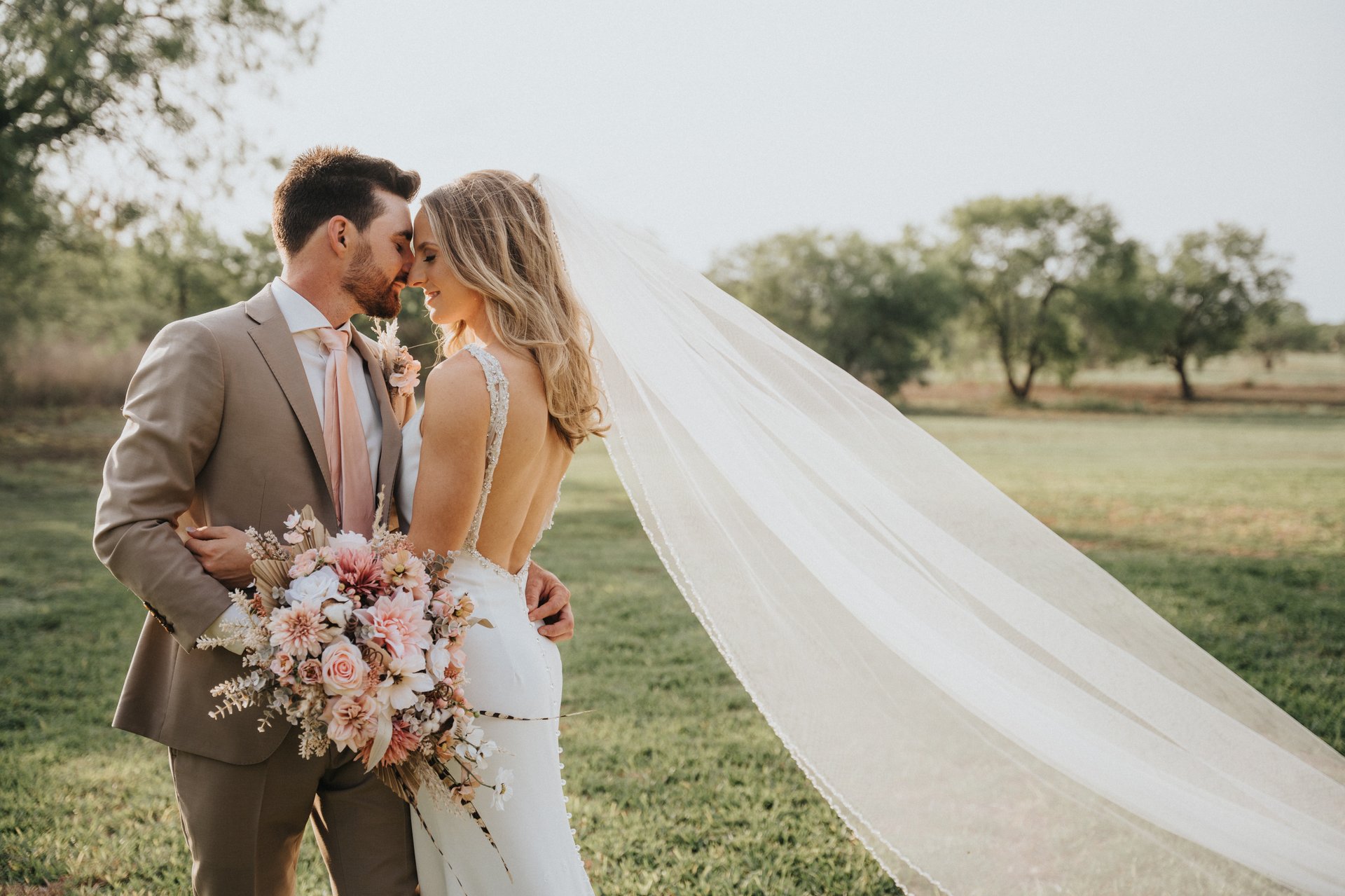 an abstract photo of a curved building with a blue sky in the background