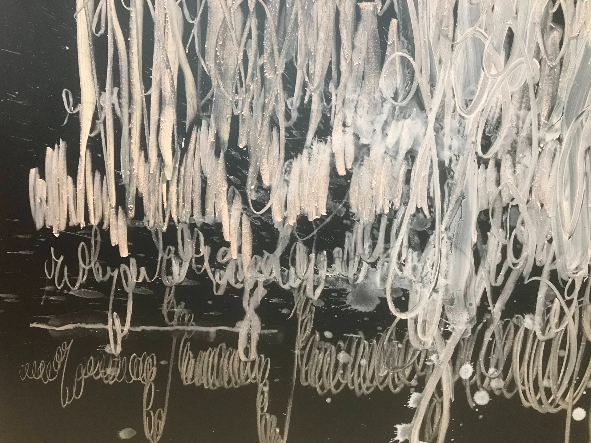 an abstract photo of a curved building with a blue sky in the background