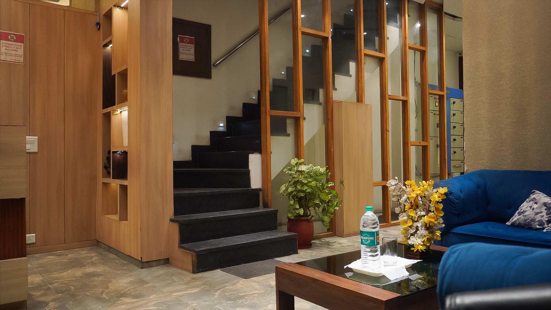 black and white bed near brown wooden table