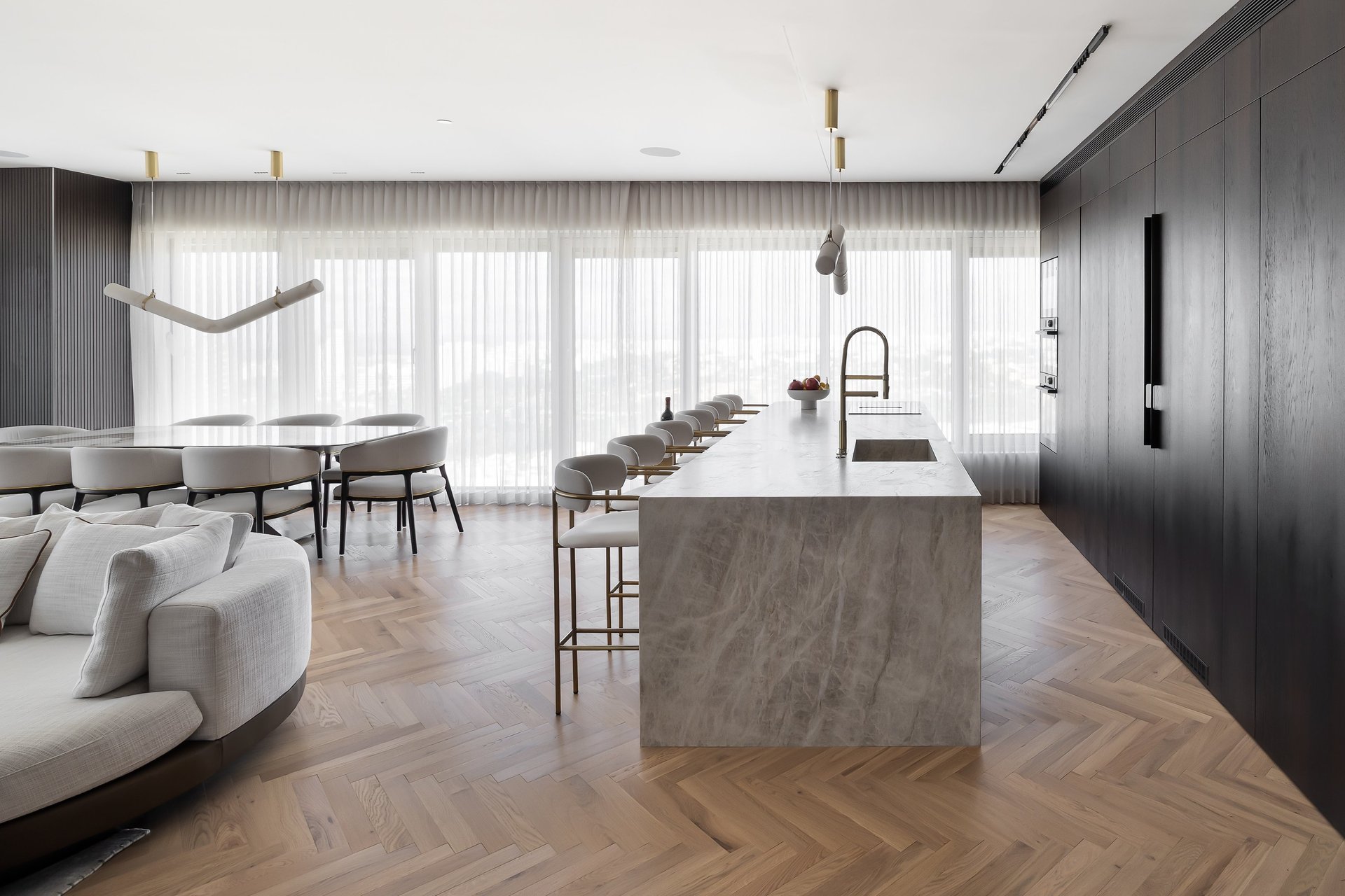 an abstract photo of a curved building with a blue sky in the background