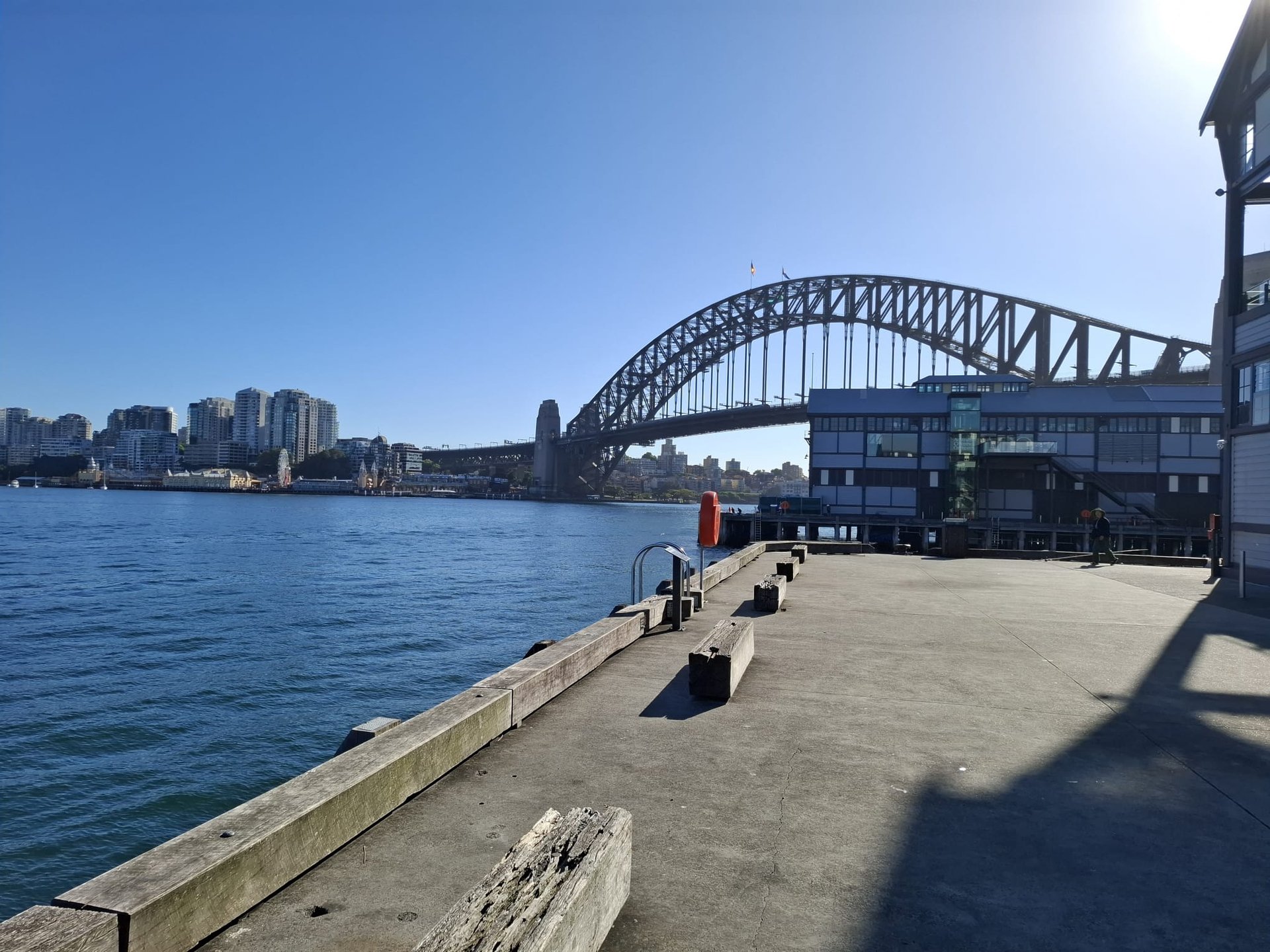 an abstract photo of a curved building with a blue sky in the background
