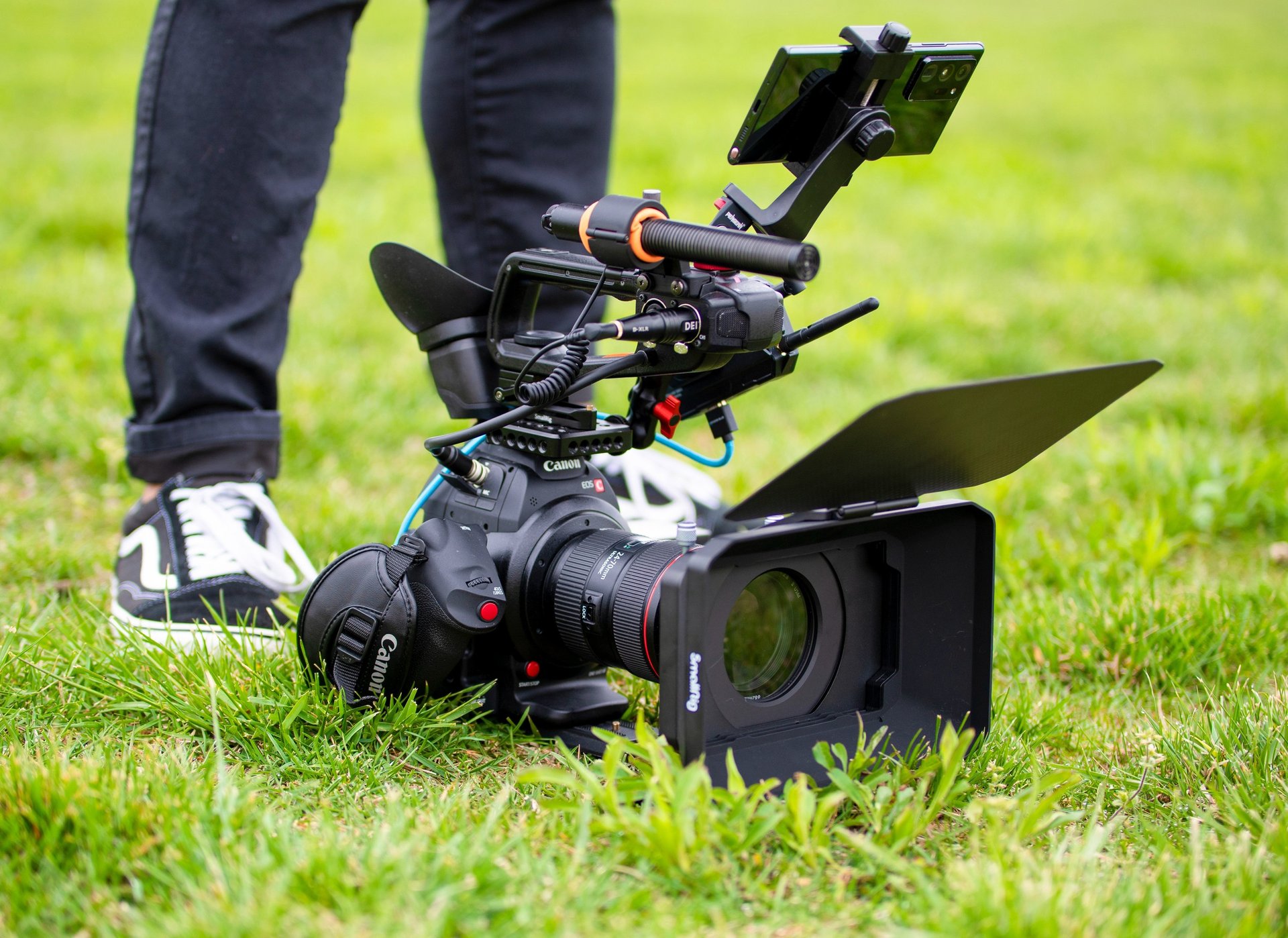 an abstract photo of a curved building with a blue sky in the background