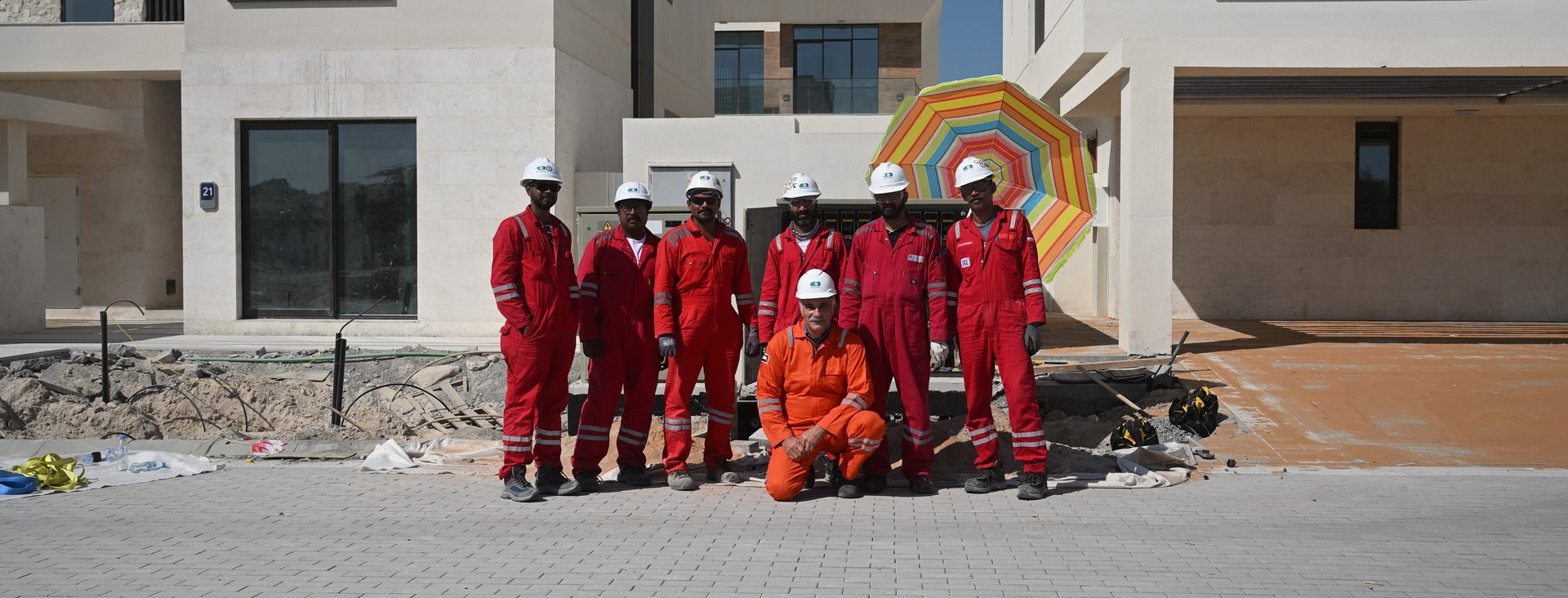 an abstract photo of a curved building with a blue sky in the background