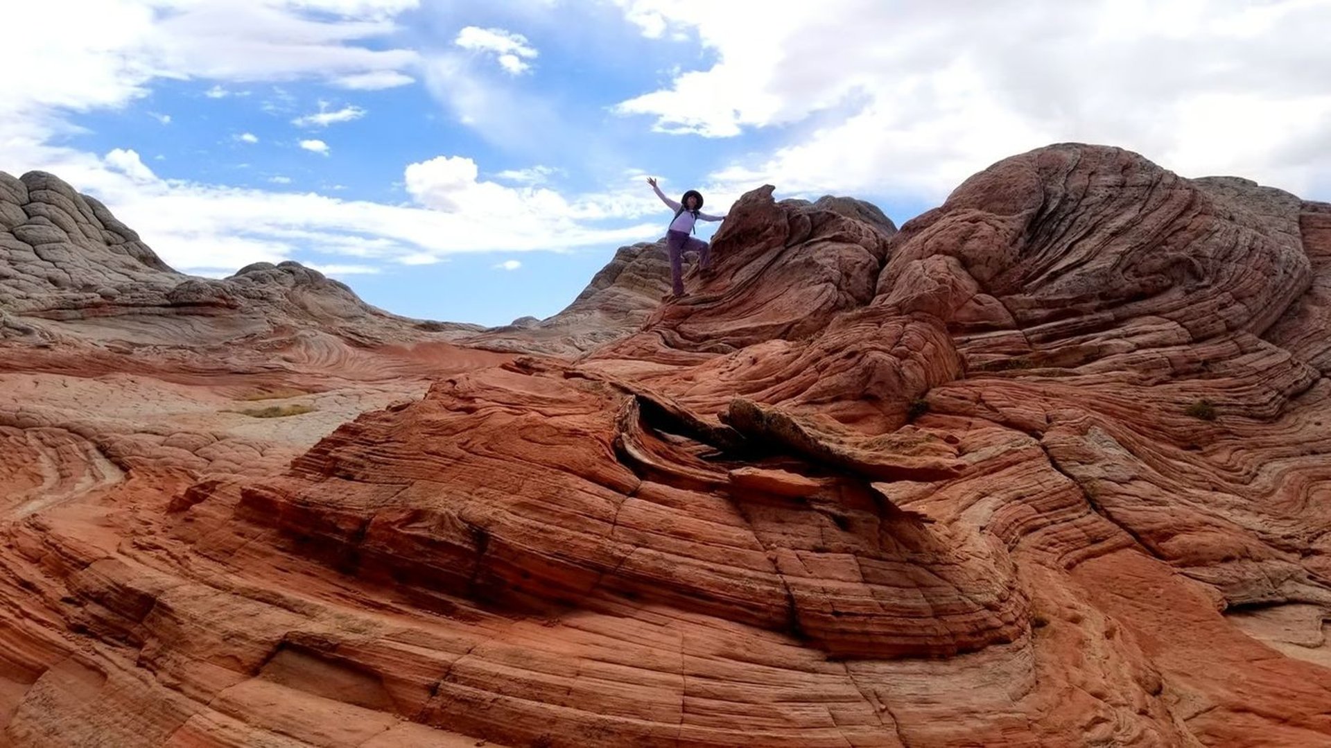 Happiness on the rocks at White Pocket within Vermilion Cliffs National Monument in Northern Arizona, near the Utah border