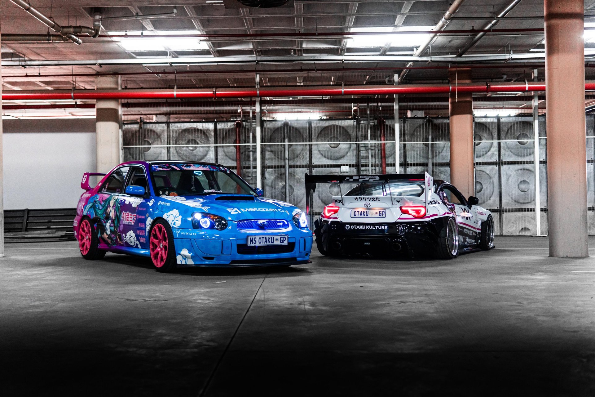person holding black and silver nissan steering wheel