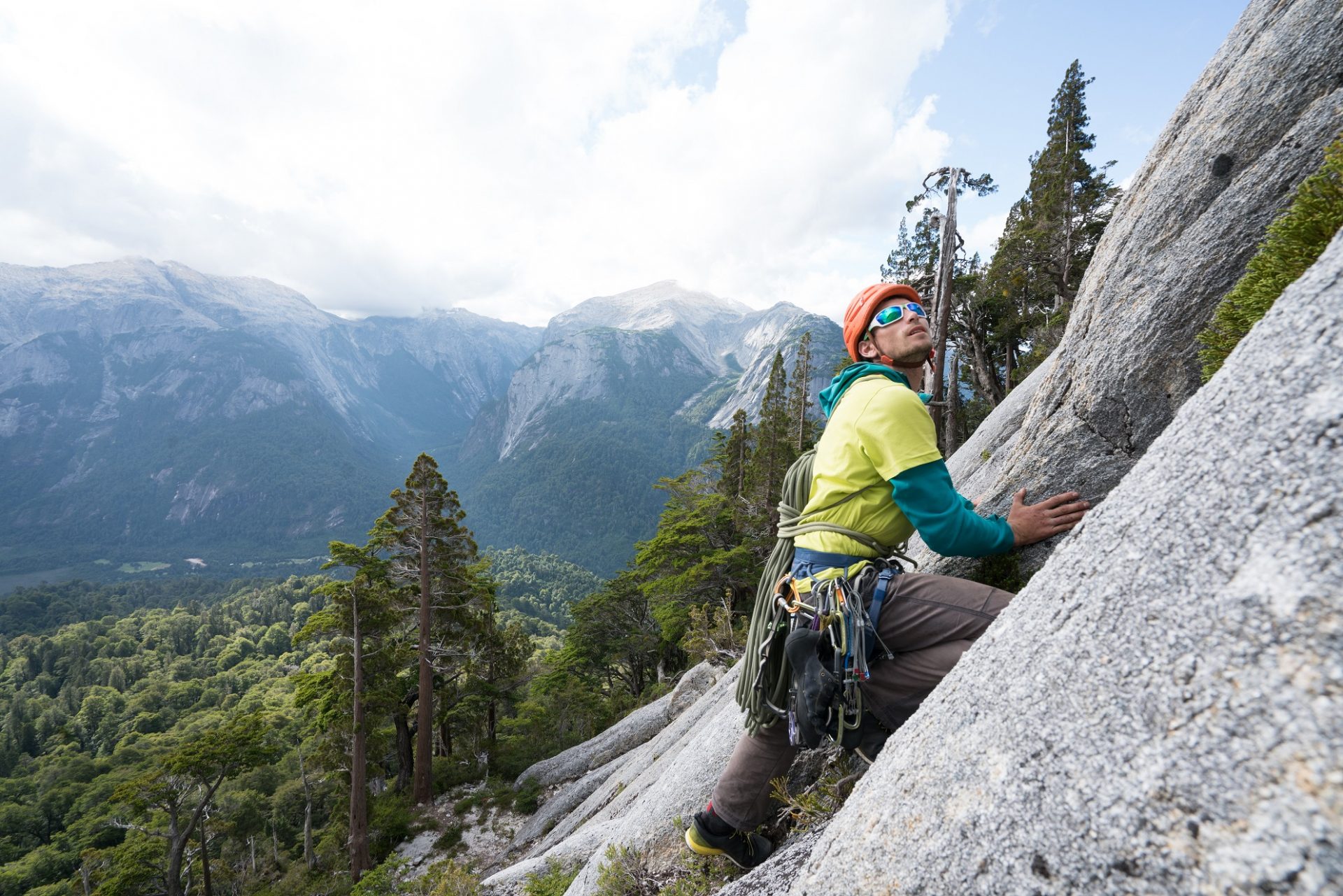 an abstract photo of a curved building with a blue sky in the background
