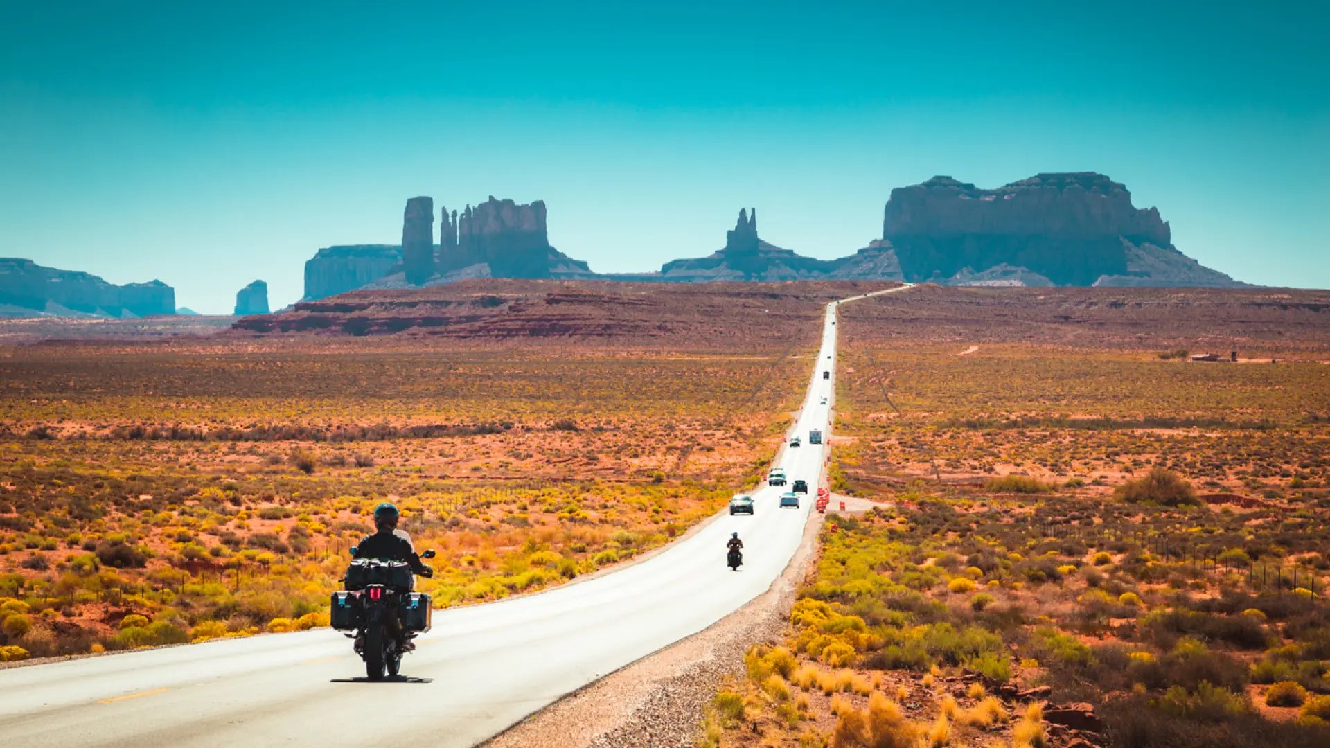 an abstract photo of a curved building with a blue sky in the background