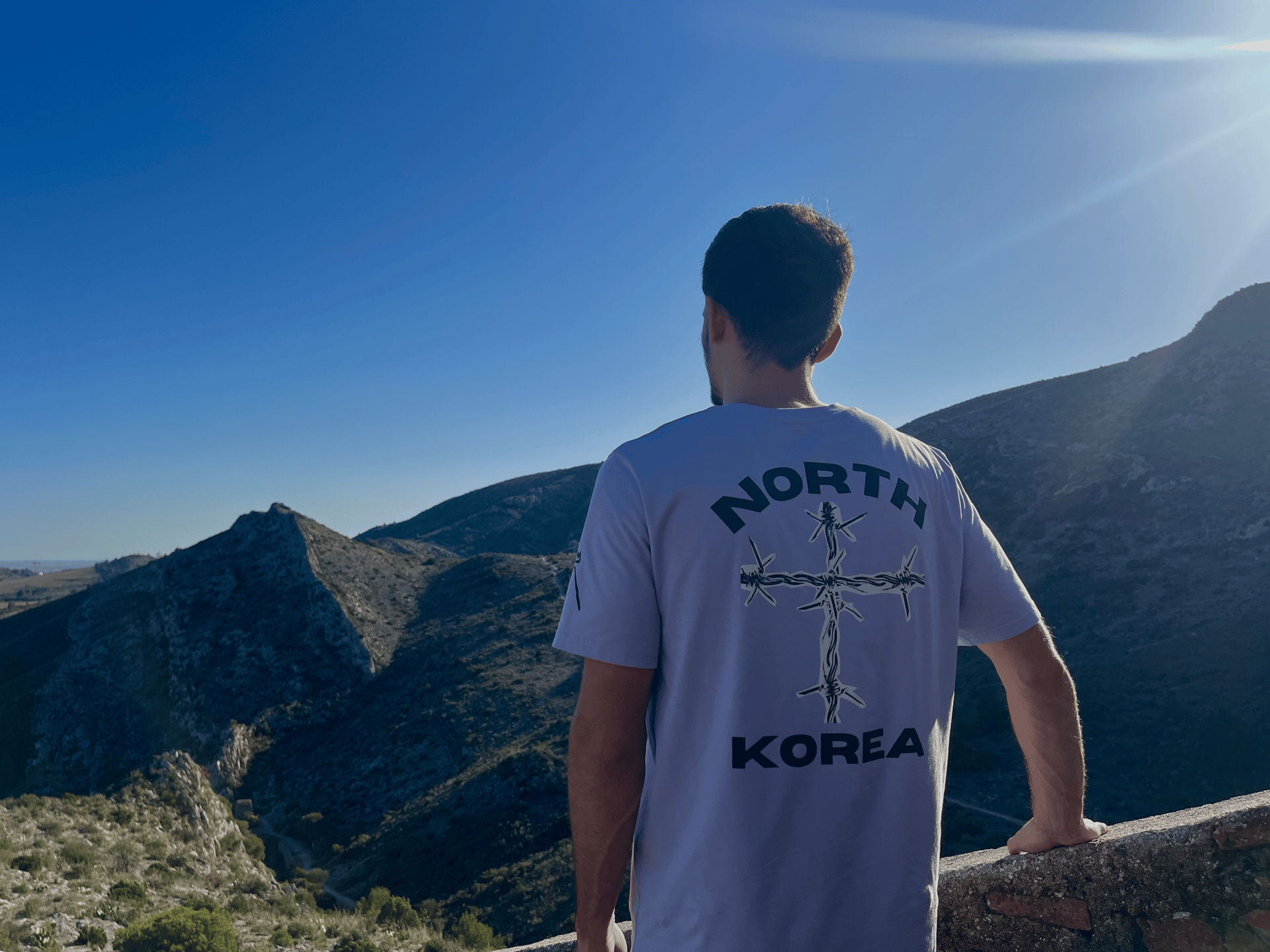 an abstract photo of a curved building with a blue sky in the background