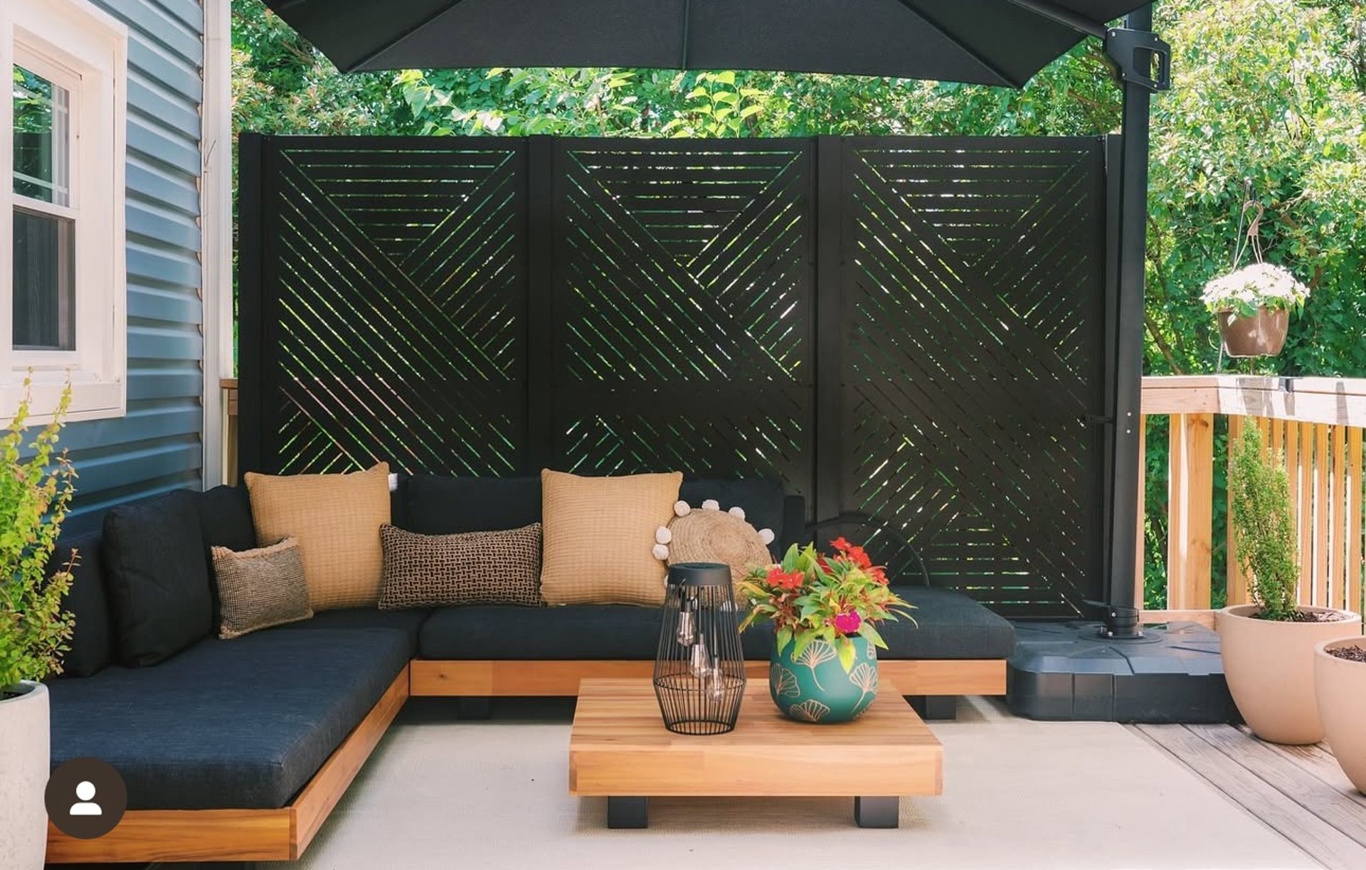A large hot tub sitting next to a brick building