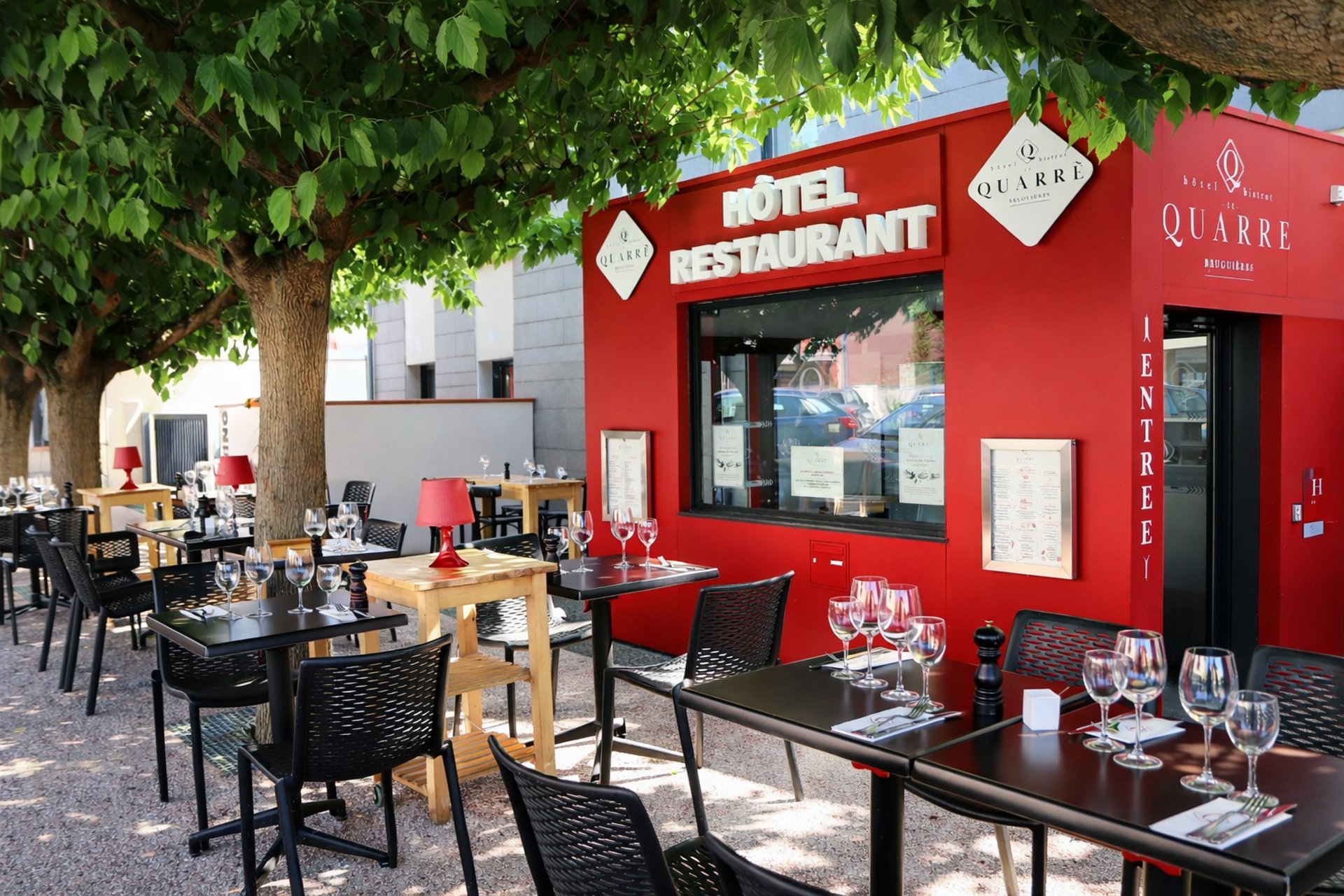 white bed linen with throw pillows