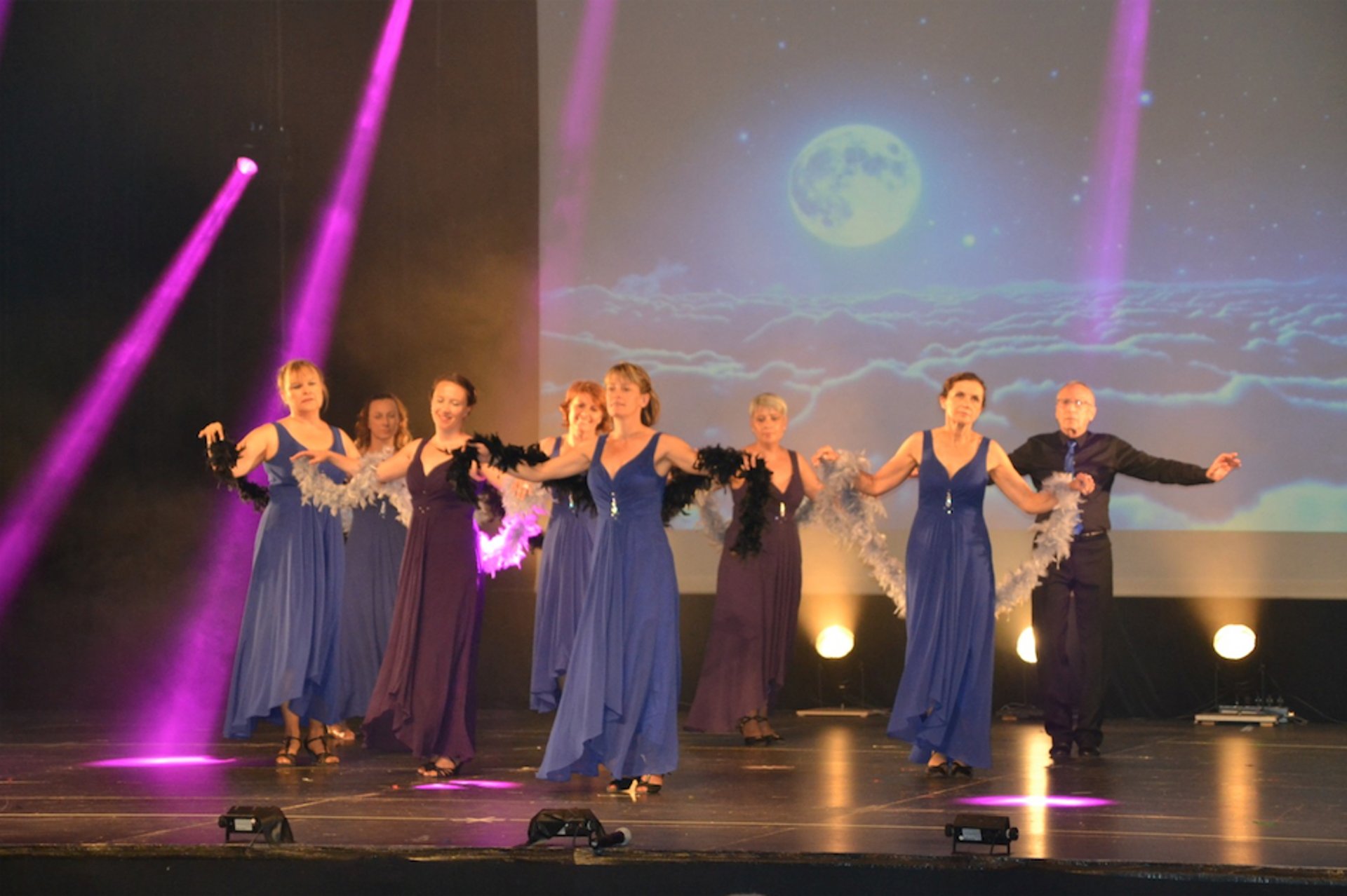an abstract photo of a curved building with a blue sky in the background
