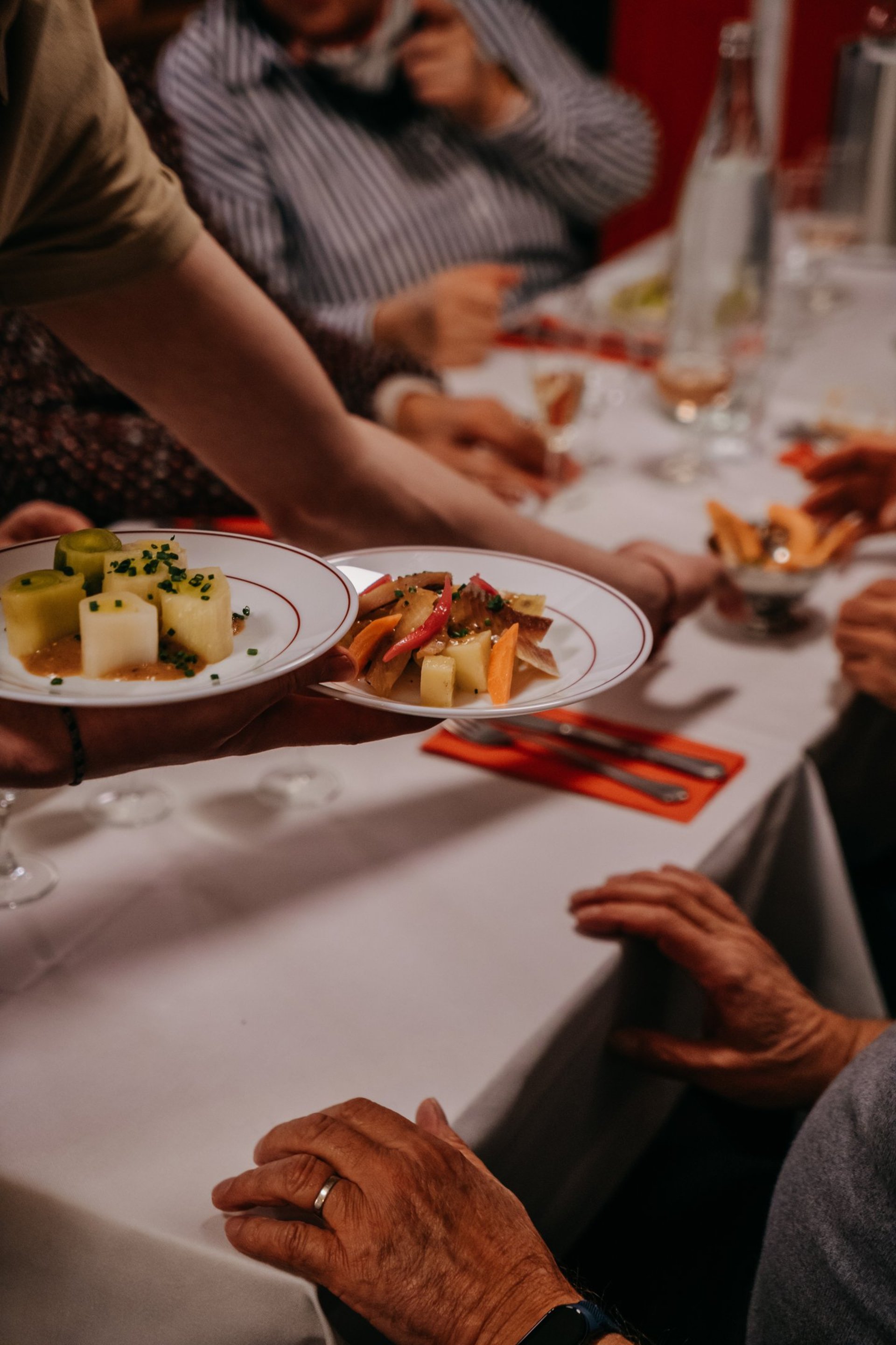 woman holding fork in front table