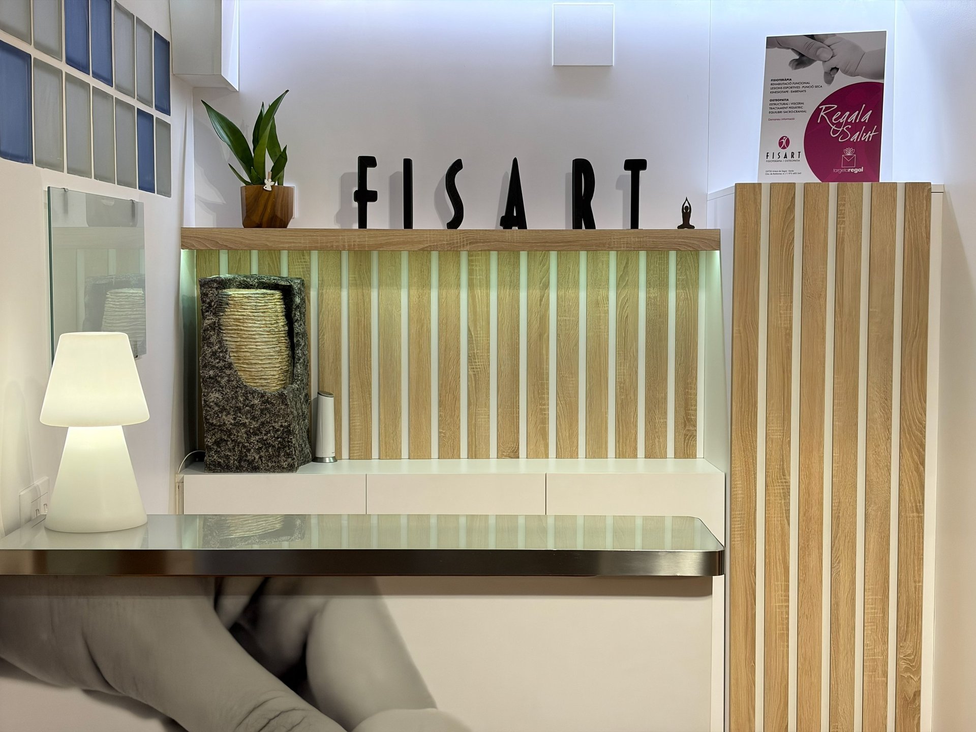 an abstract photo of a curved building with a blue sky in the background