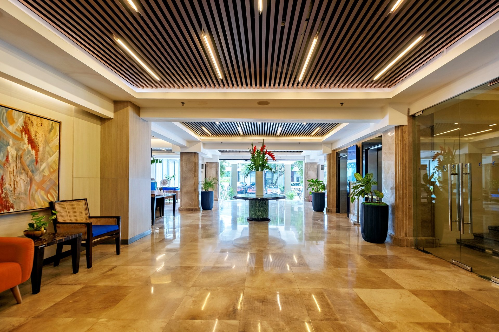 an abstract photo of a curved building with a blue sky in the background