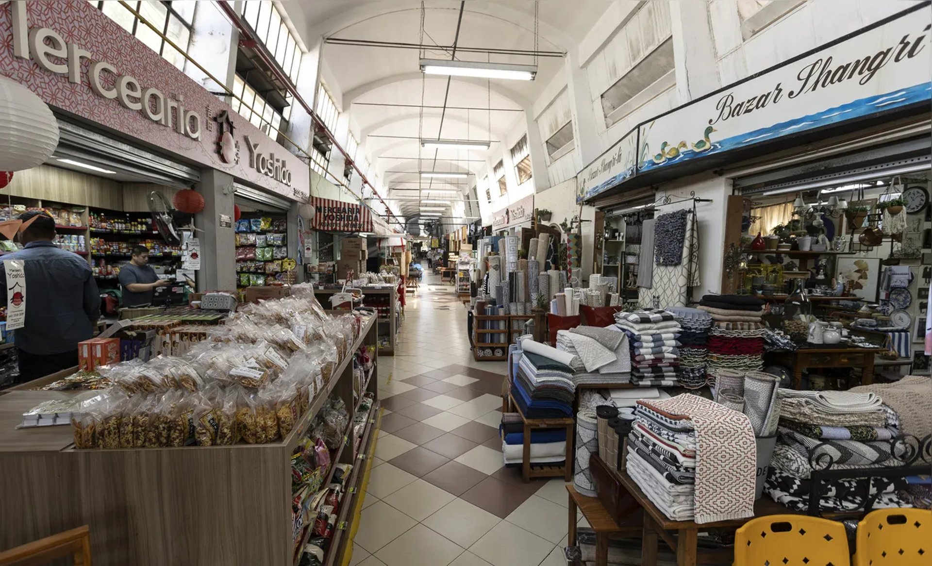 an abstract photo of a curved building with a blue sky in the background
