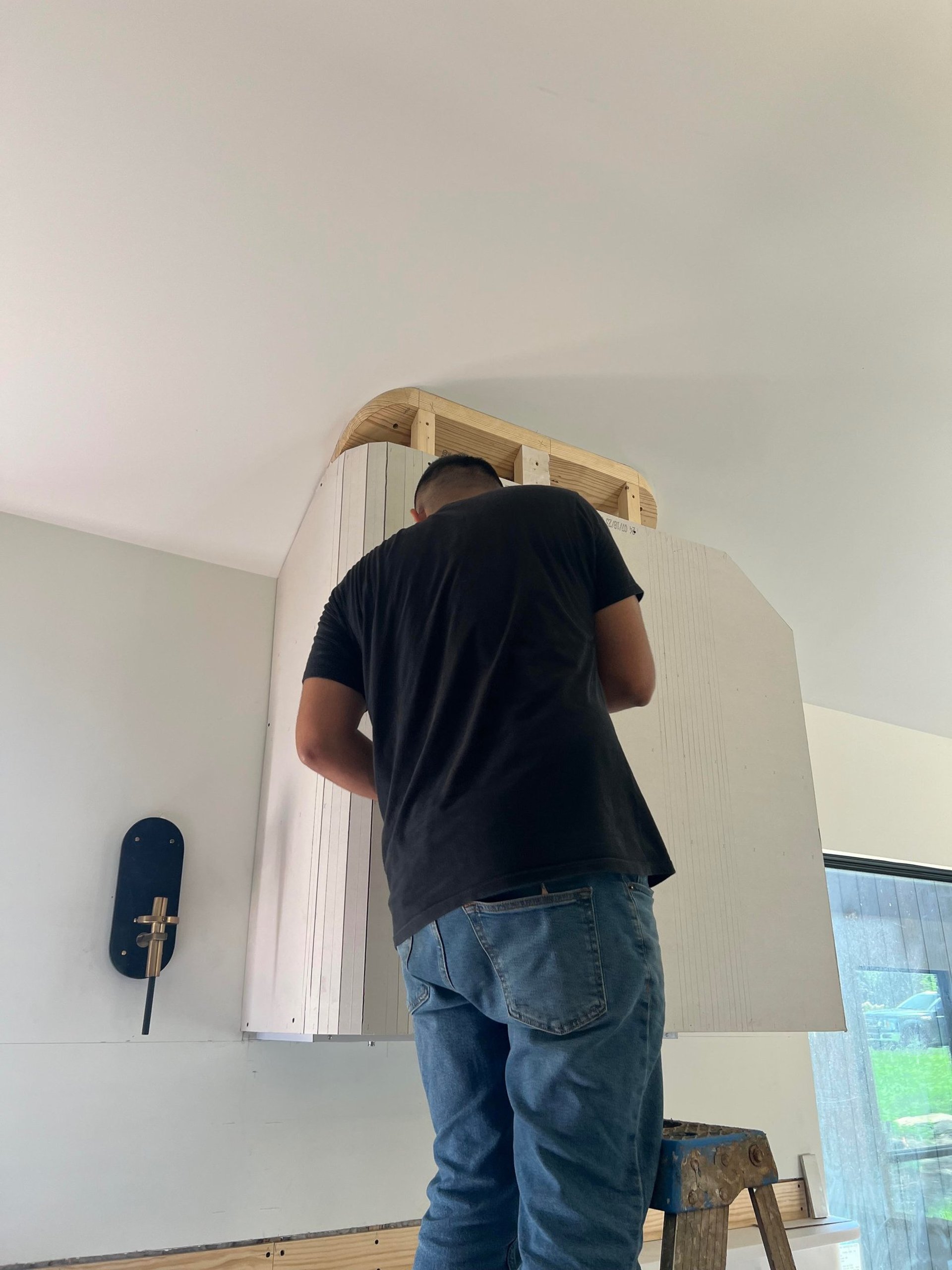 Photo of a Passion Painters worker installing drywall in a home in Asheville,nc