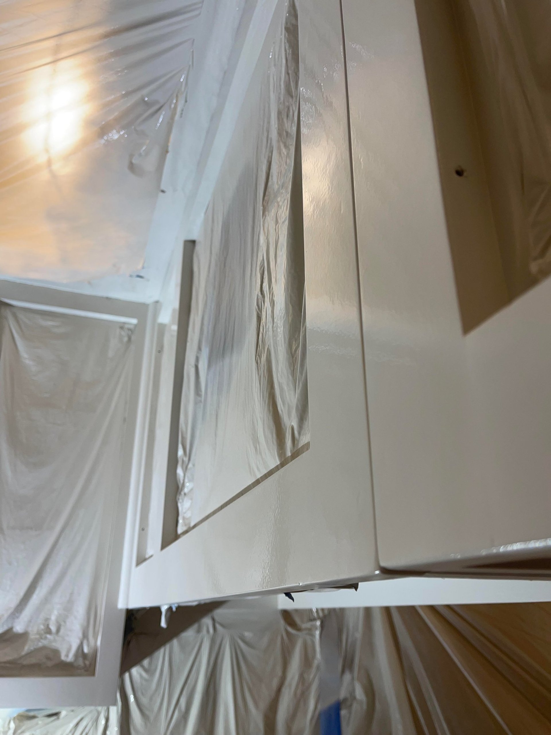 Kitchen cabinets that were sprayed and what they look like when dried by Passion Painters job done in Arden, NC