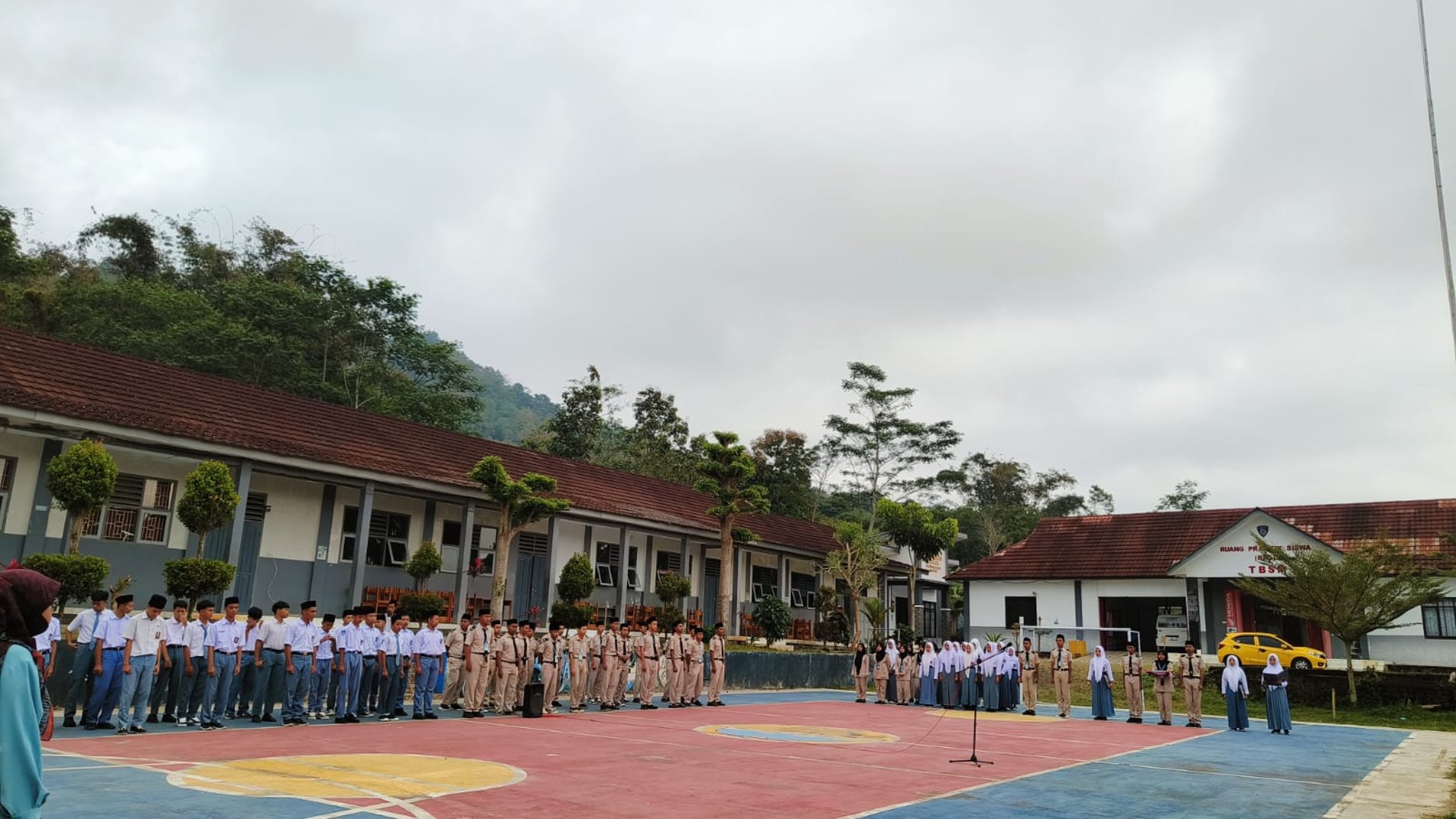 woman wearing yellow long-sleeved dress under white clouds and blue sky during daytime