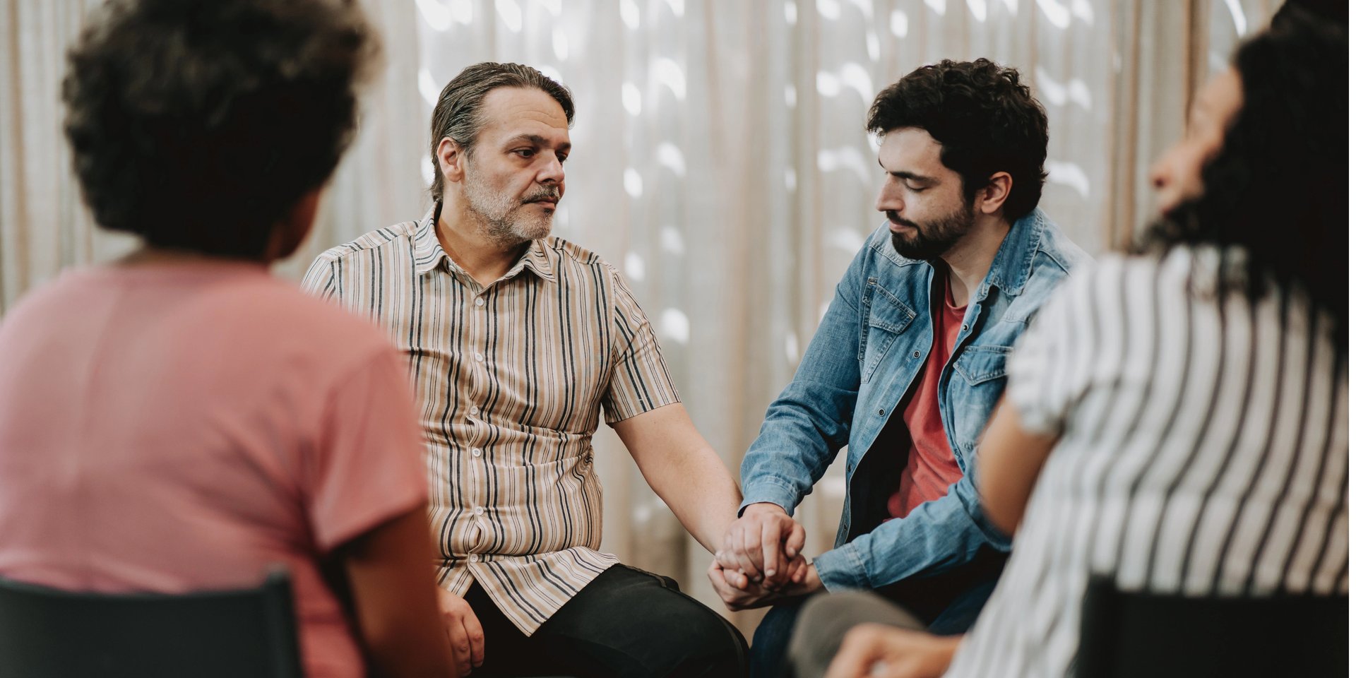 an abstract photo of a curved building with a blue sky in the background