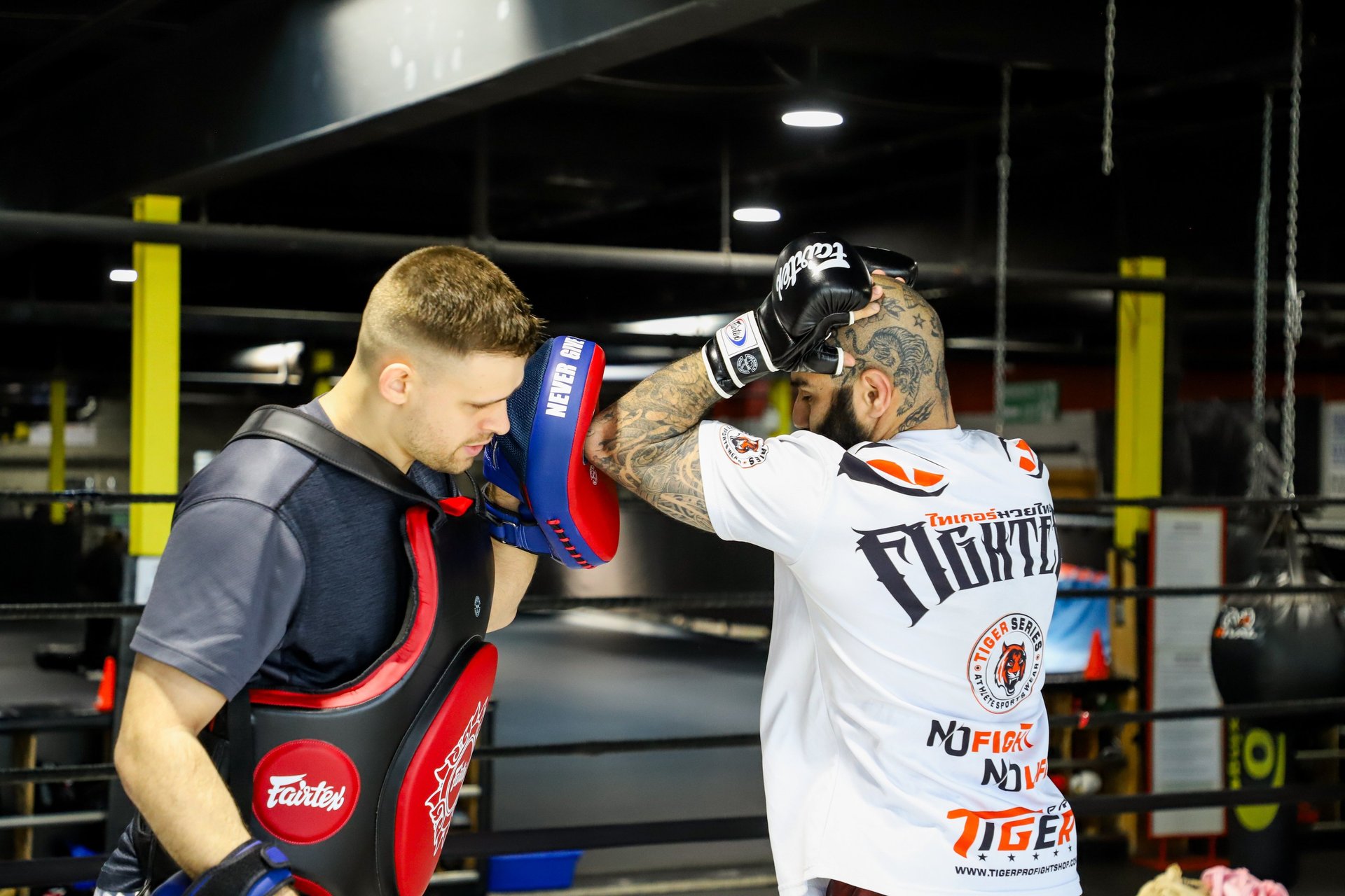 a man with a beard wearing boxing gloves