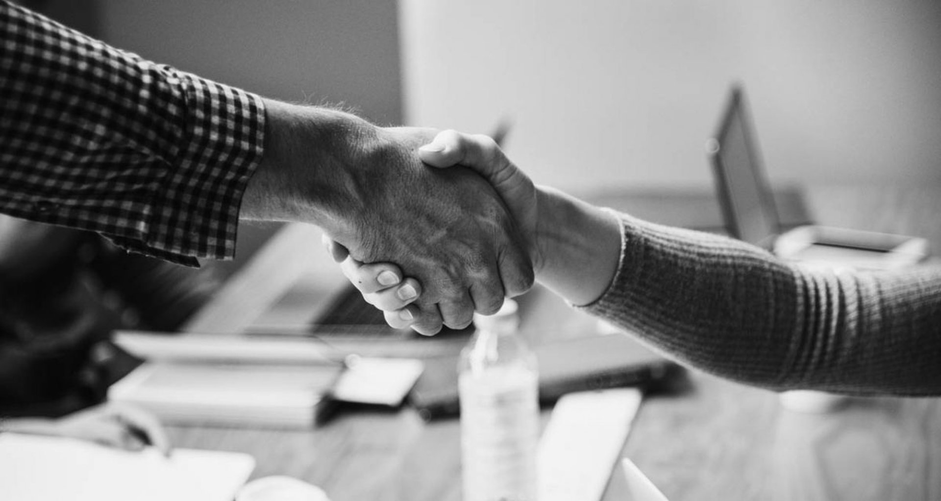 an abstract photo of a curved building with a blue sky in the background