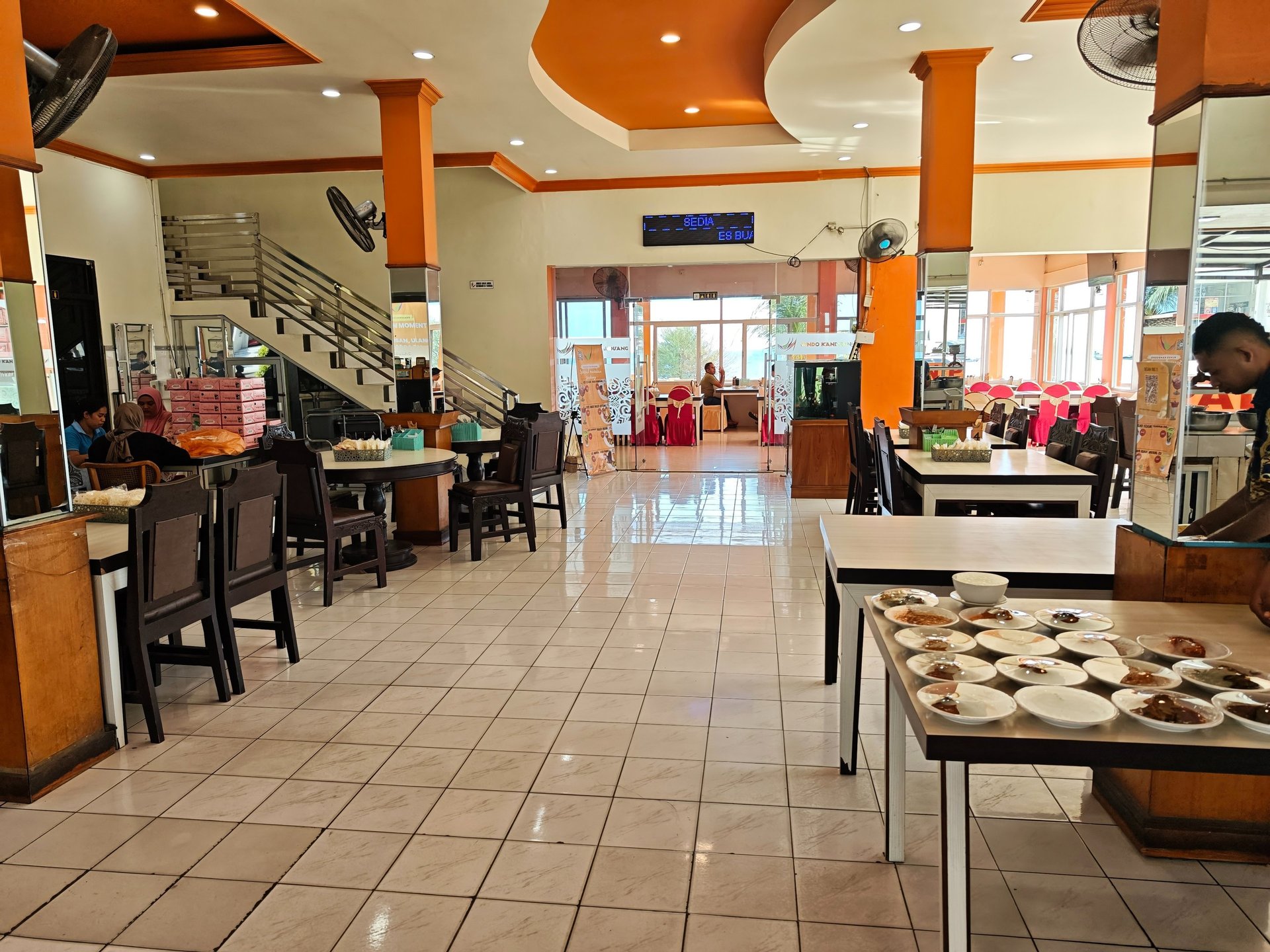 woman wearing yellow long-sleeved dress under white clouds and blue sky during daytime