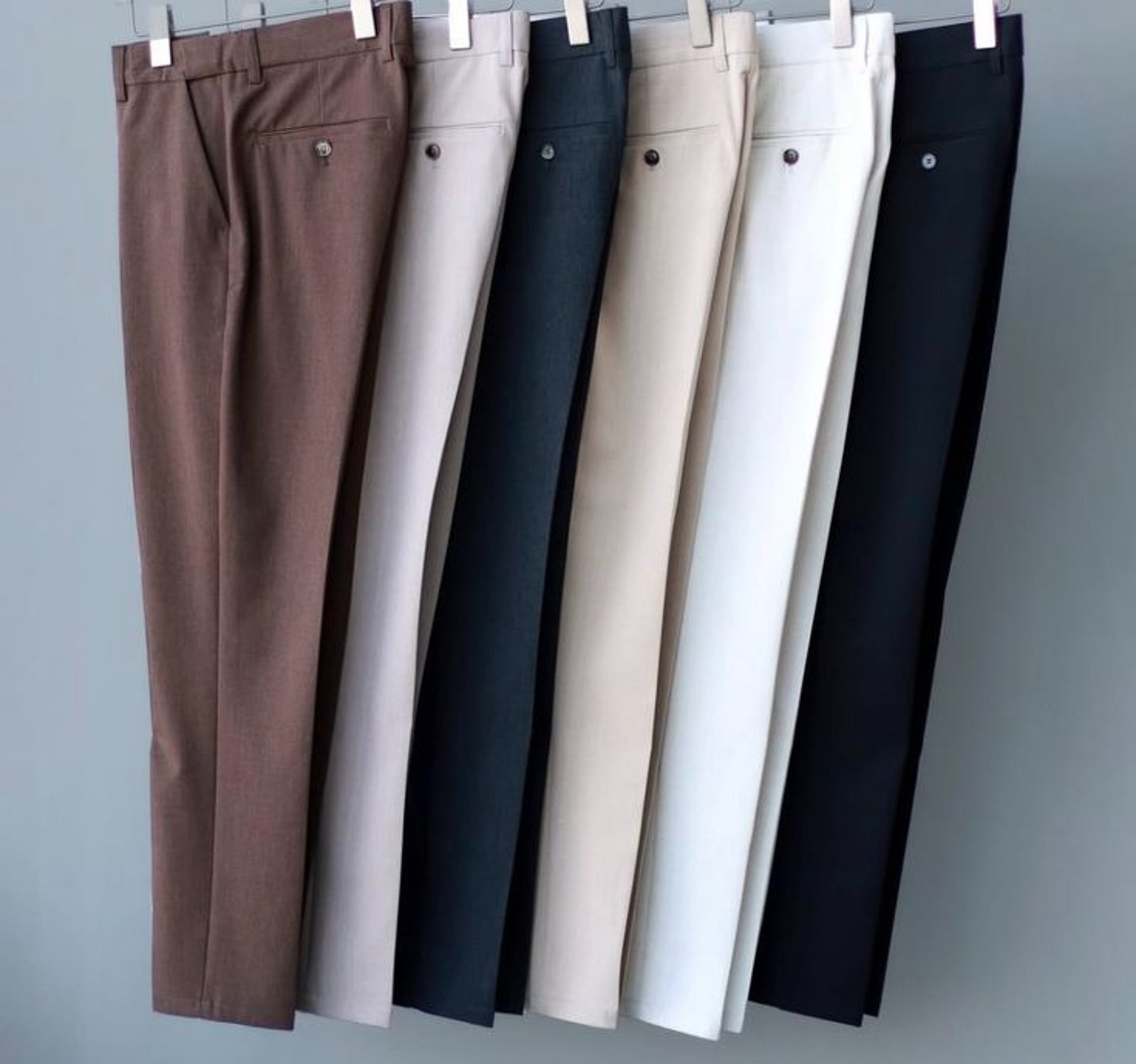 an abstract photo of a curved building with a blue sky in the background