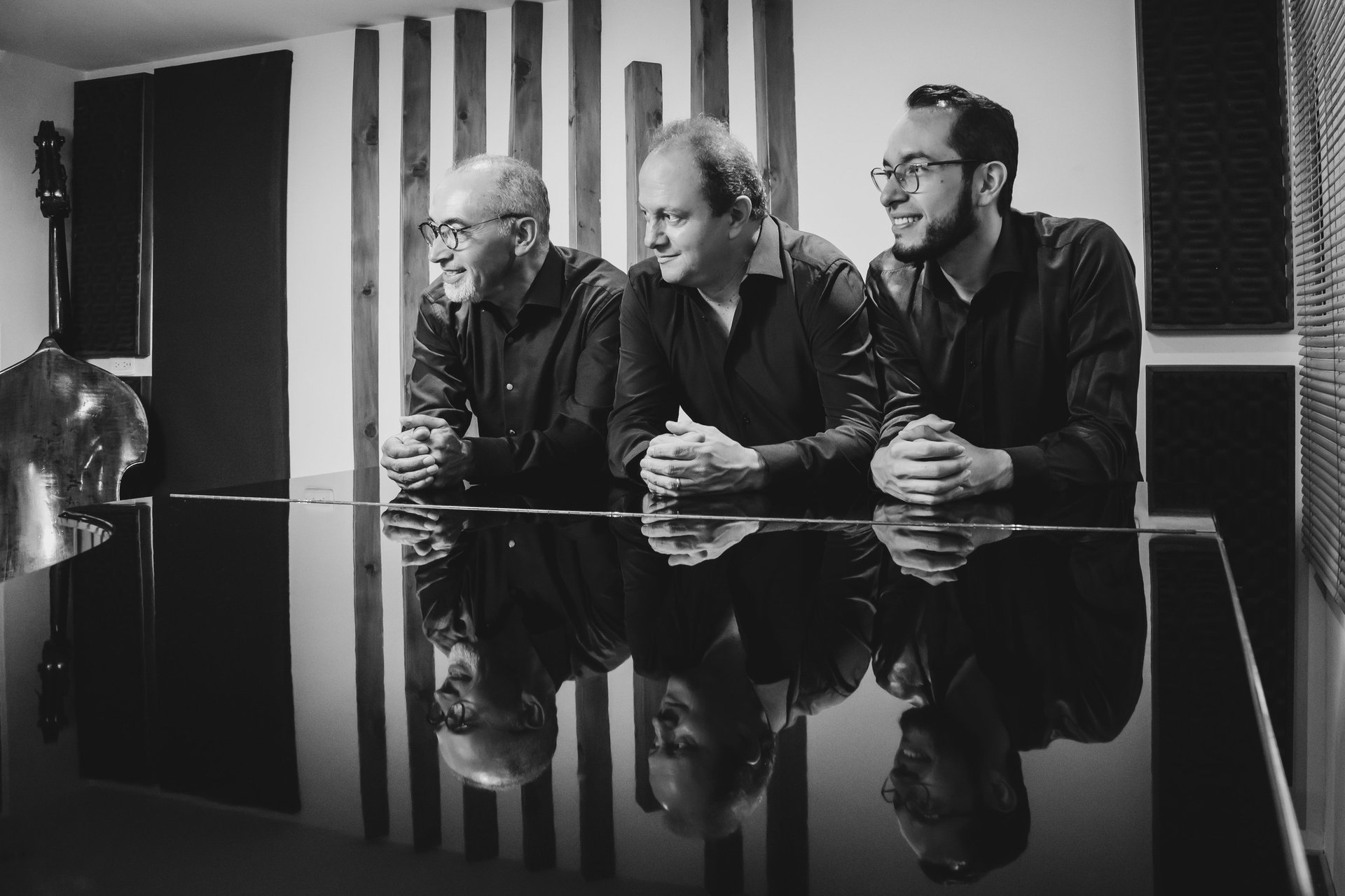an abstract photo of a curved building with a blue sky in the background