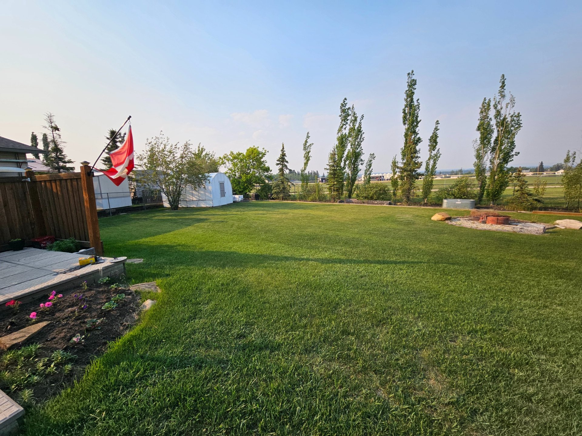 white and brown concrete building near green grass field during daytime