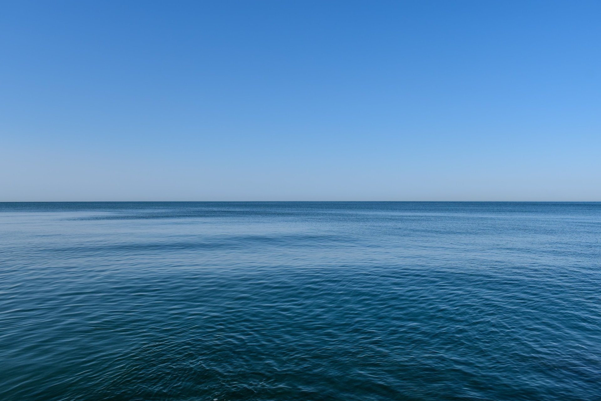a large boat floating on top of a large body of water