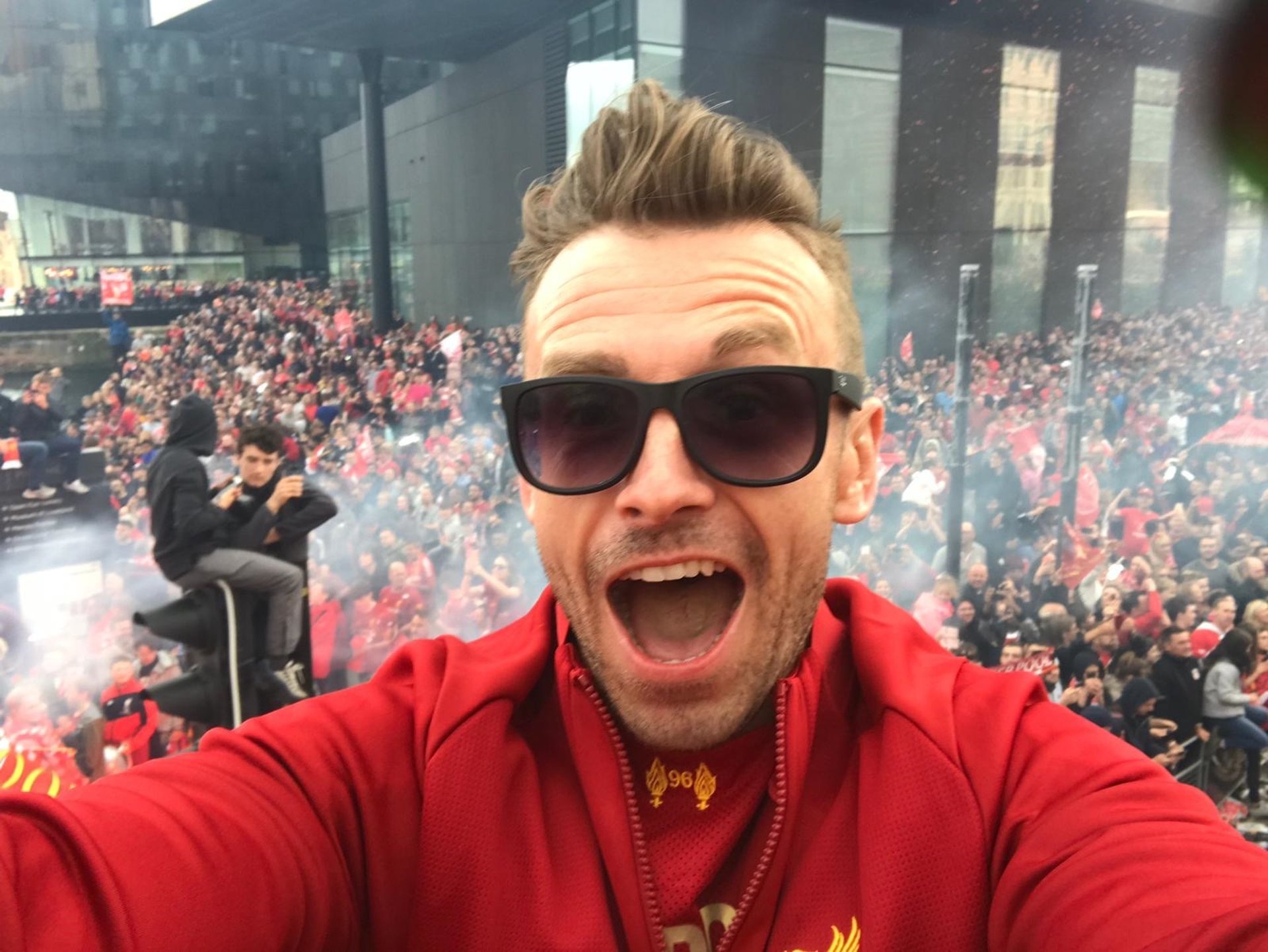 an abstract photo of a curved building with a blue sky in the background