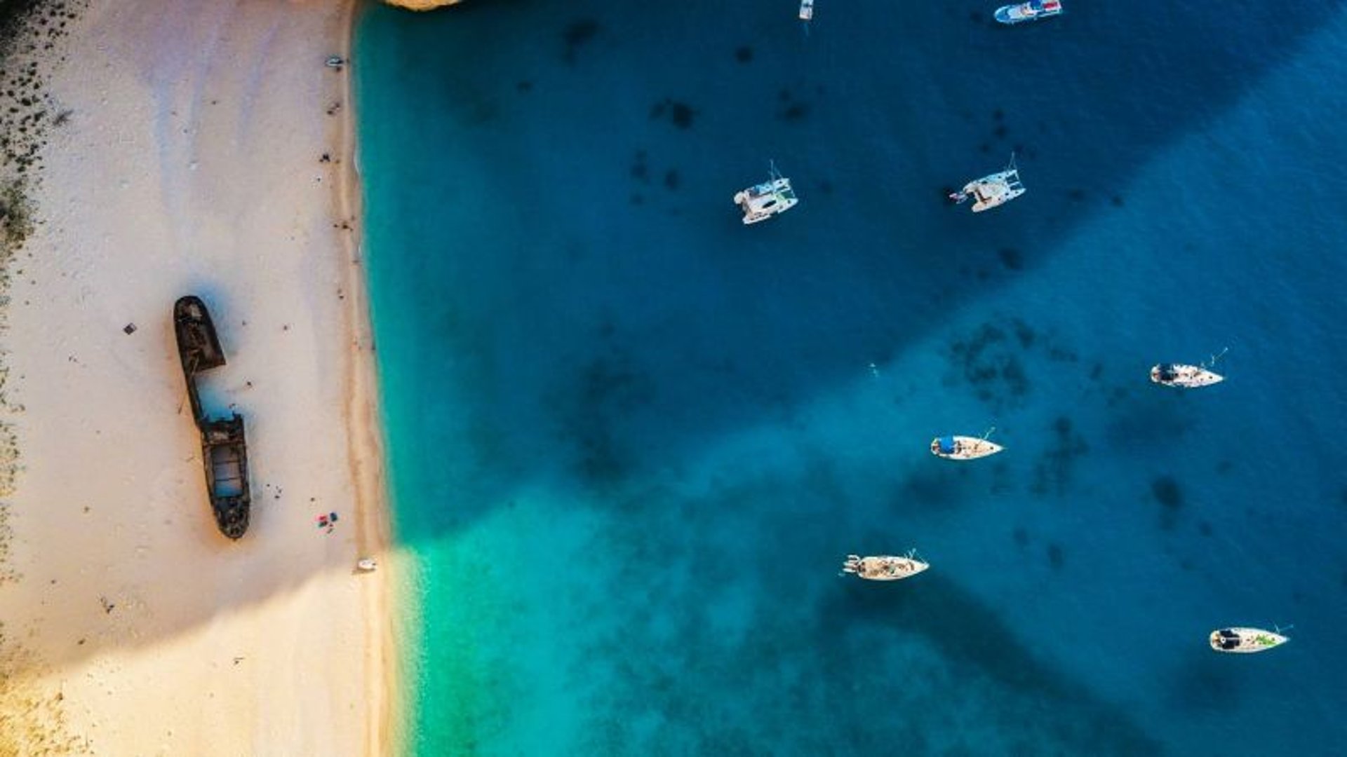 white boat sailing on water