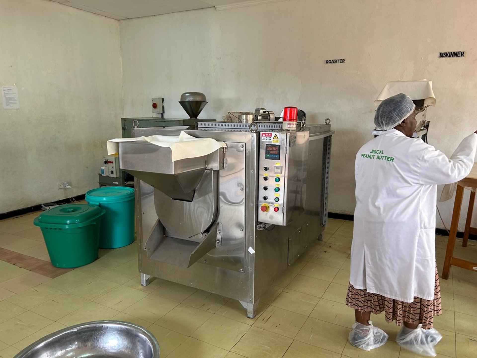 Young boy balances large bowl of food on head