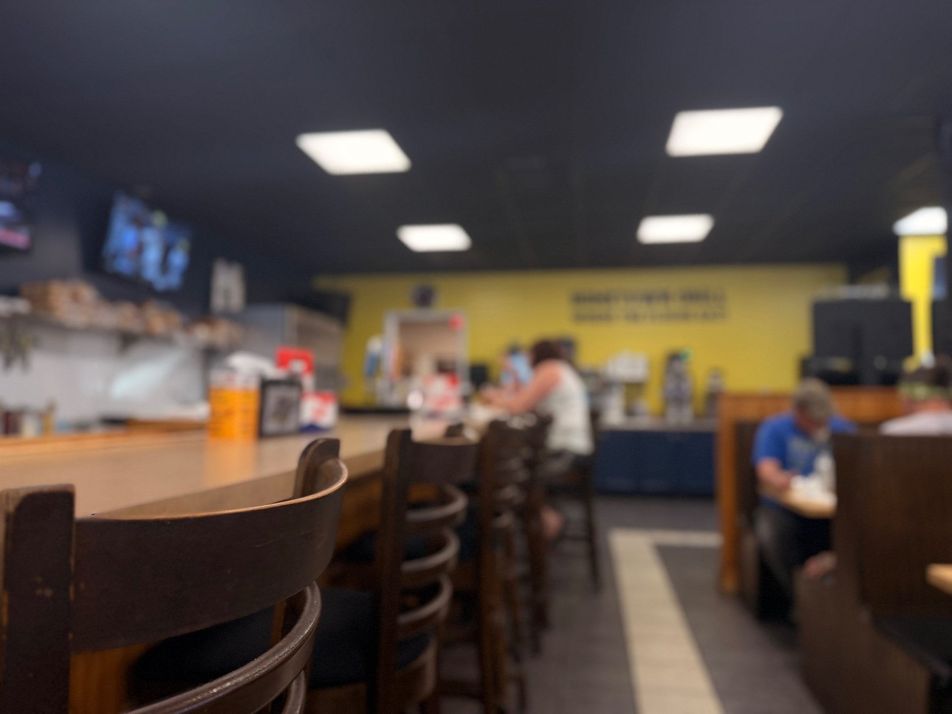 an abstract photo of a curved building with a blue sky in the background