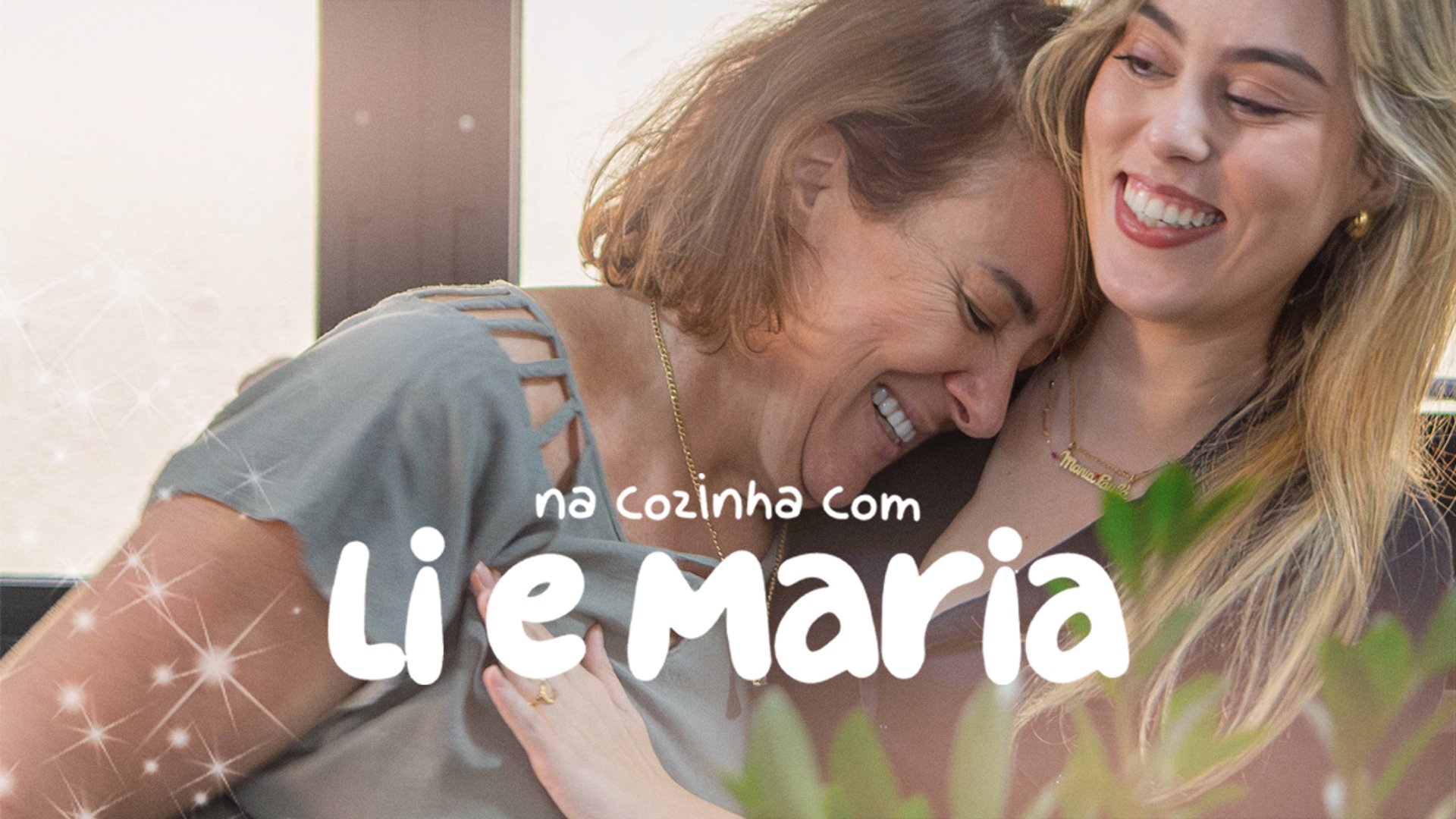 woman with brown hair wearing white and black floral hijab