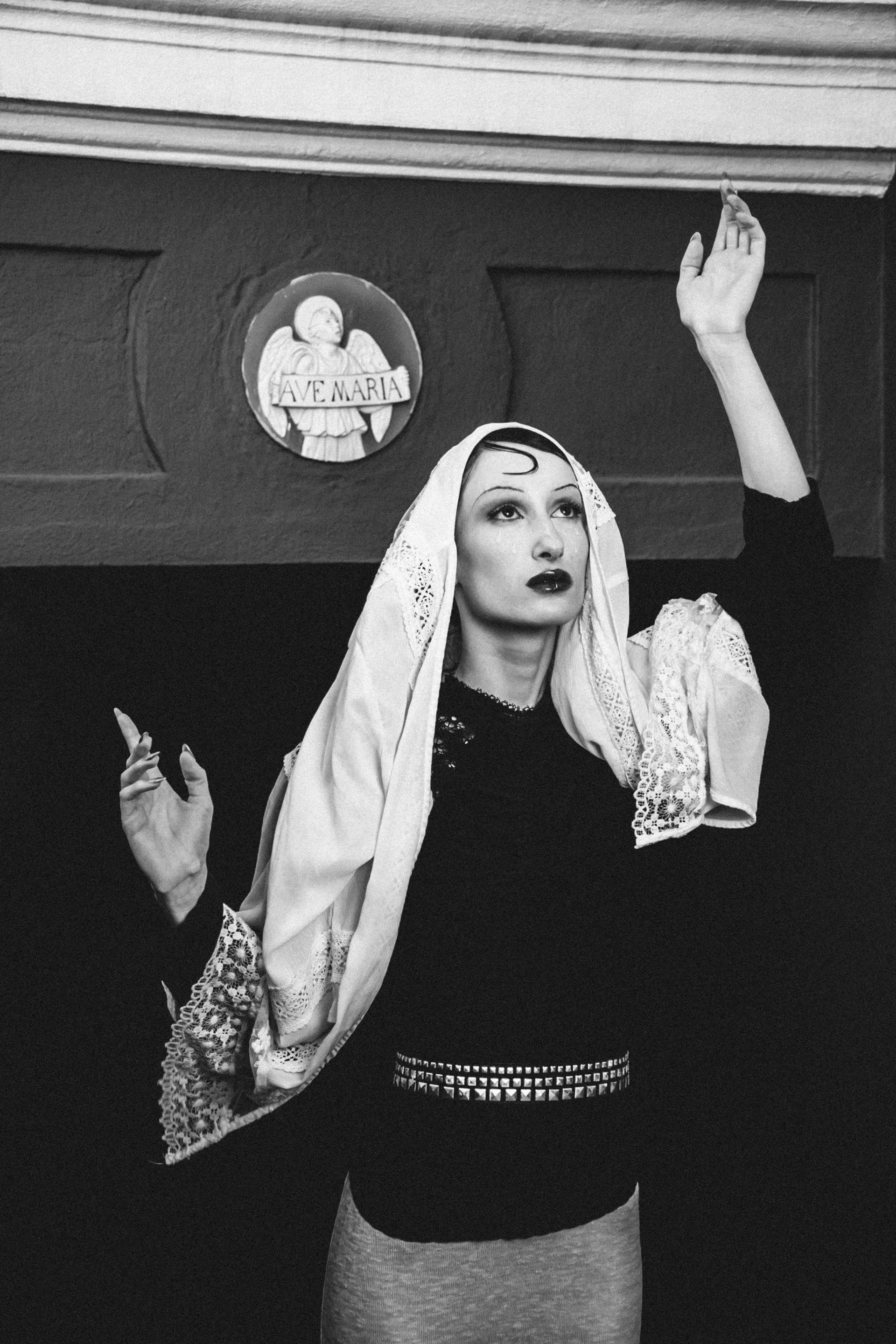 woman wearing yellow long-sleeved dress under white clouds and blue sky during daytime