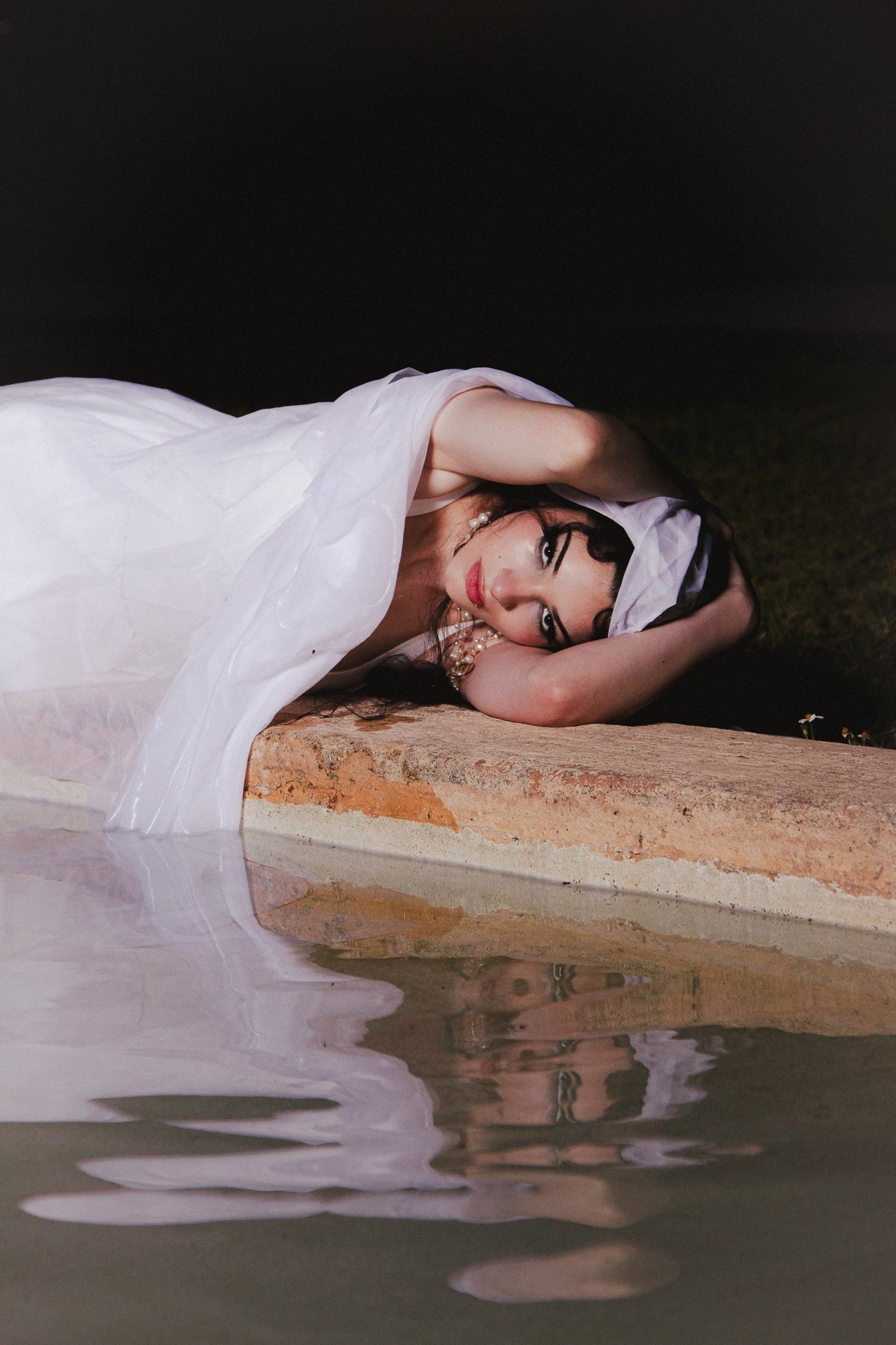 woman wearing yellow long-sleeved dress under white clouds and blue sky during daytime