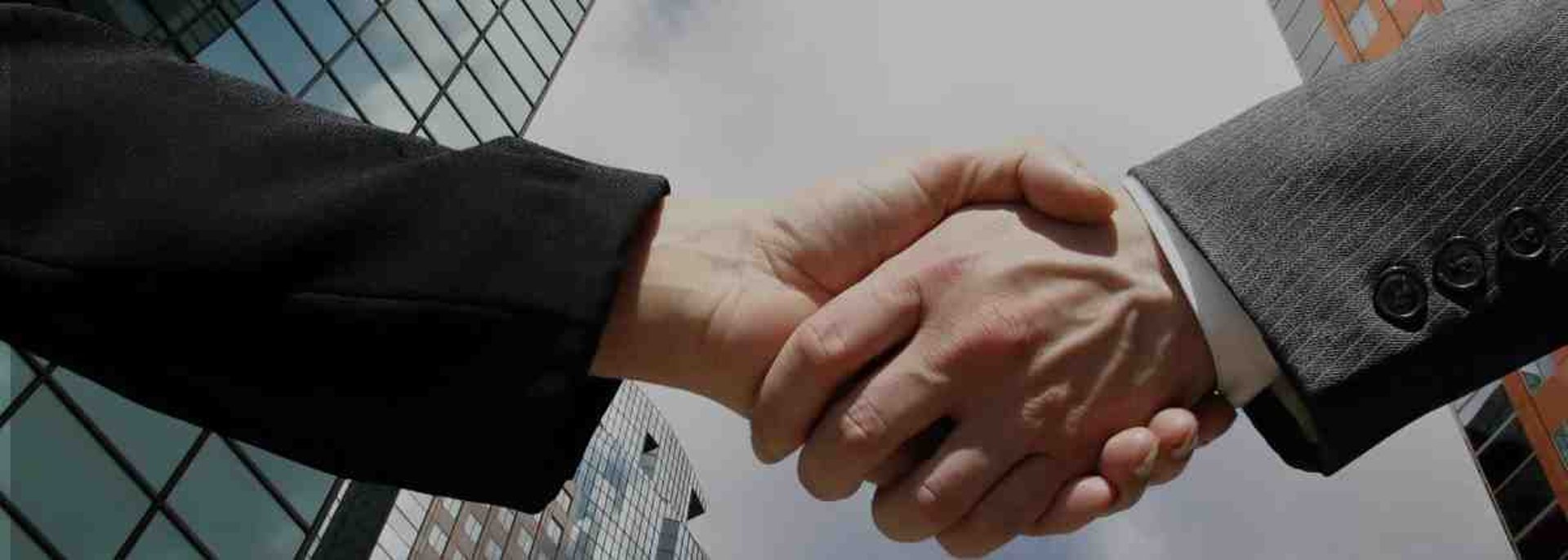 an abstract photo of a curved building with a blue sky in the background