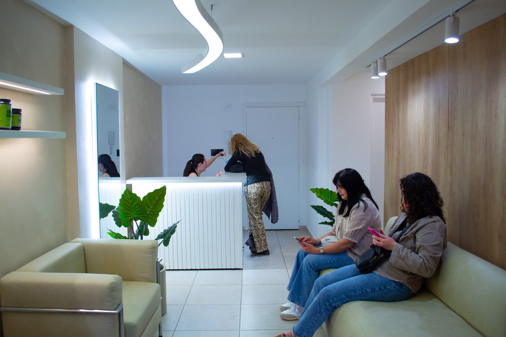 an abstract photo of a curved building with a blue sky in the background