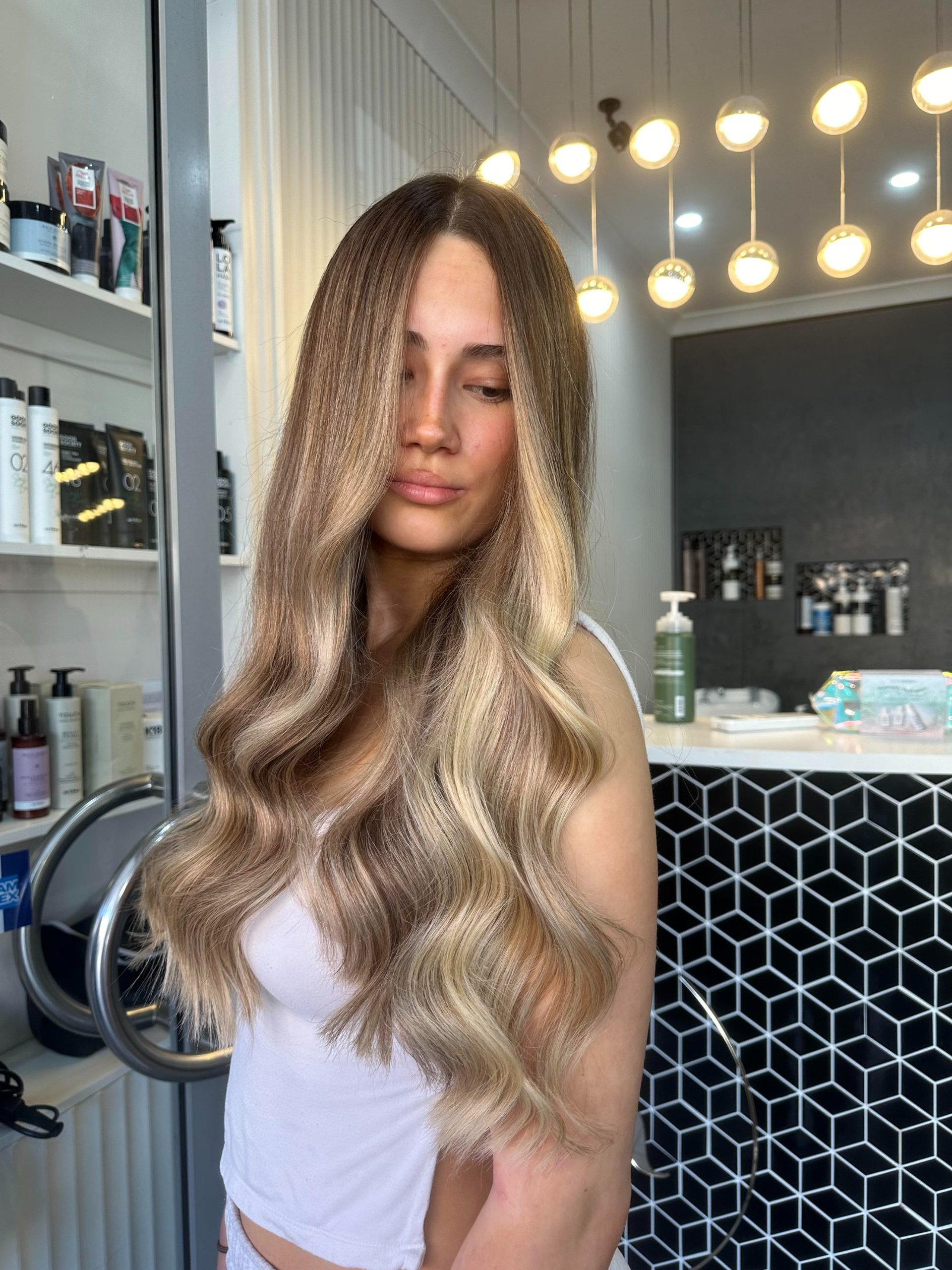 woman wearing yellow long-sleeved dress under white clouds and blue sky during daytime
