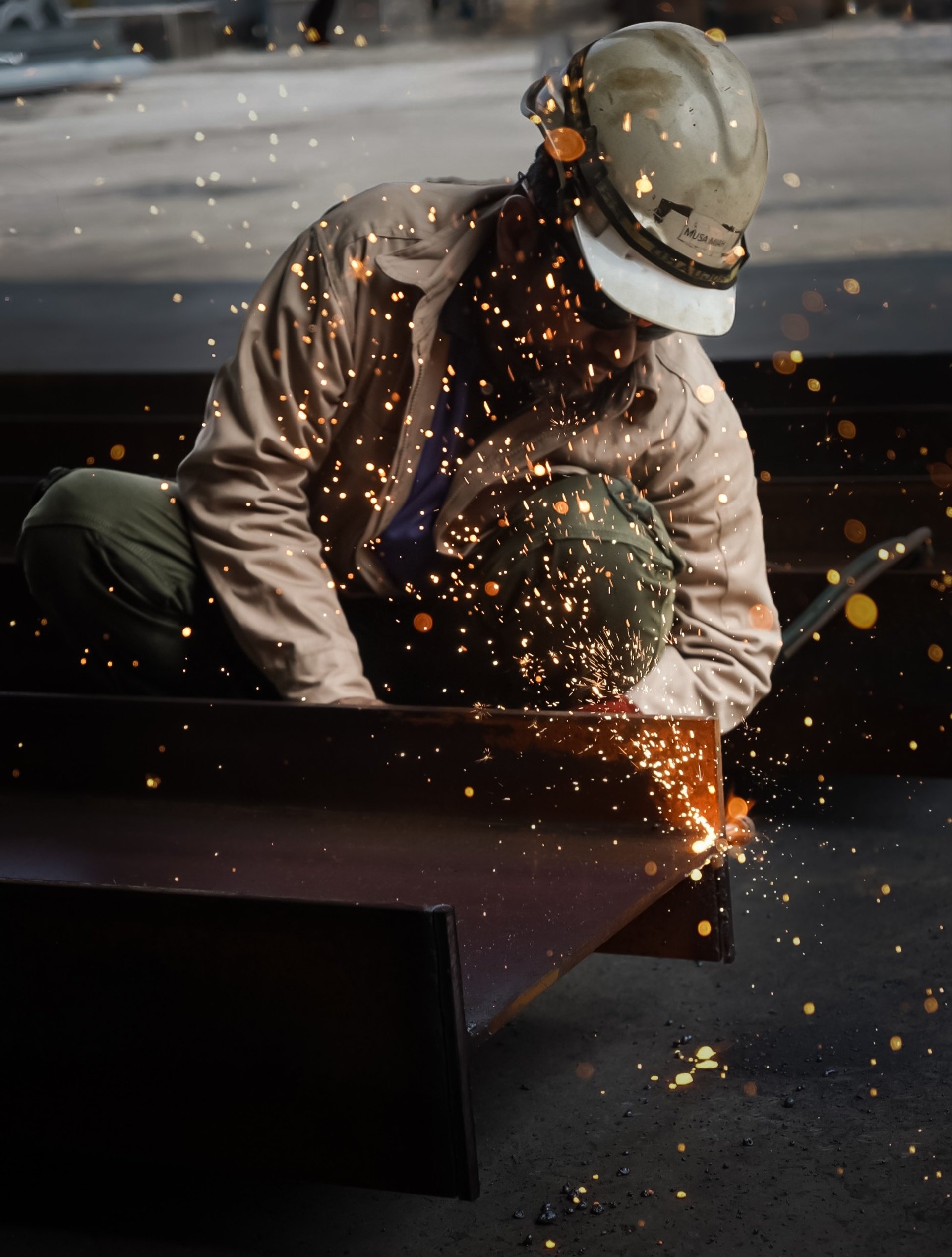 an abstract photo of a curved building with a blue sky in the background