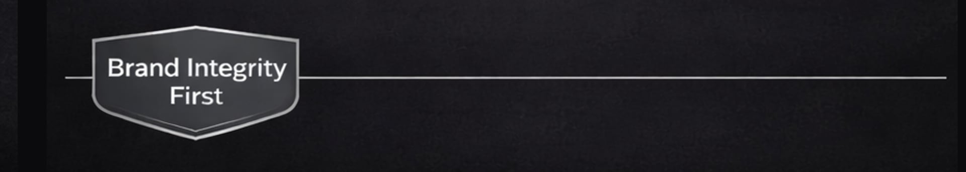 A neatly made bed with a patterned mattress and pillows.