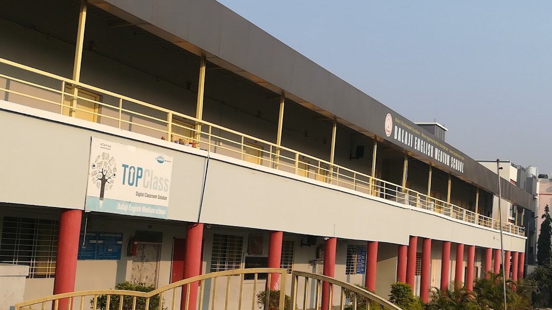 an abstract photo of a curved building with a blue sky in the background