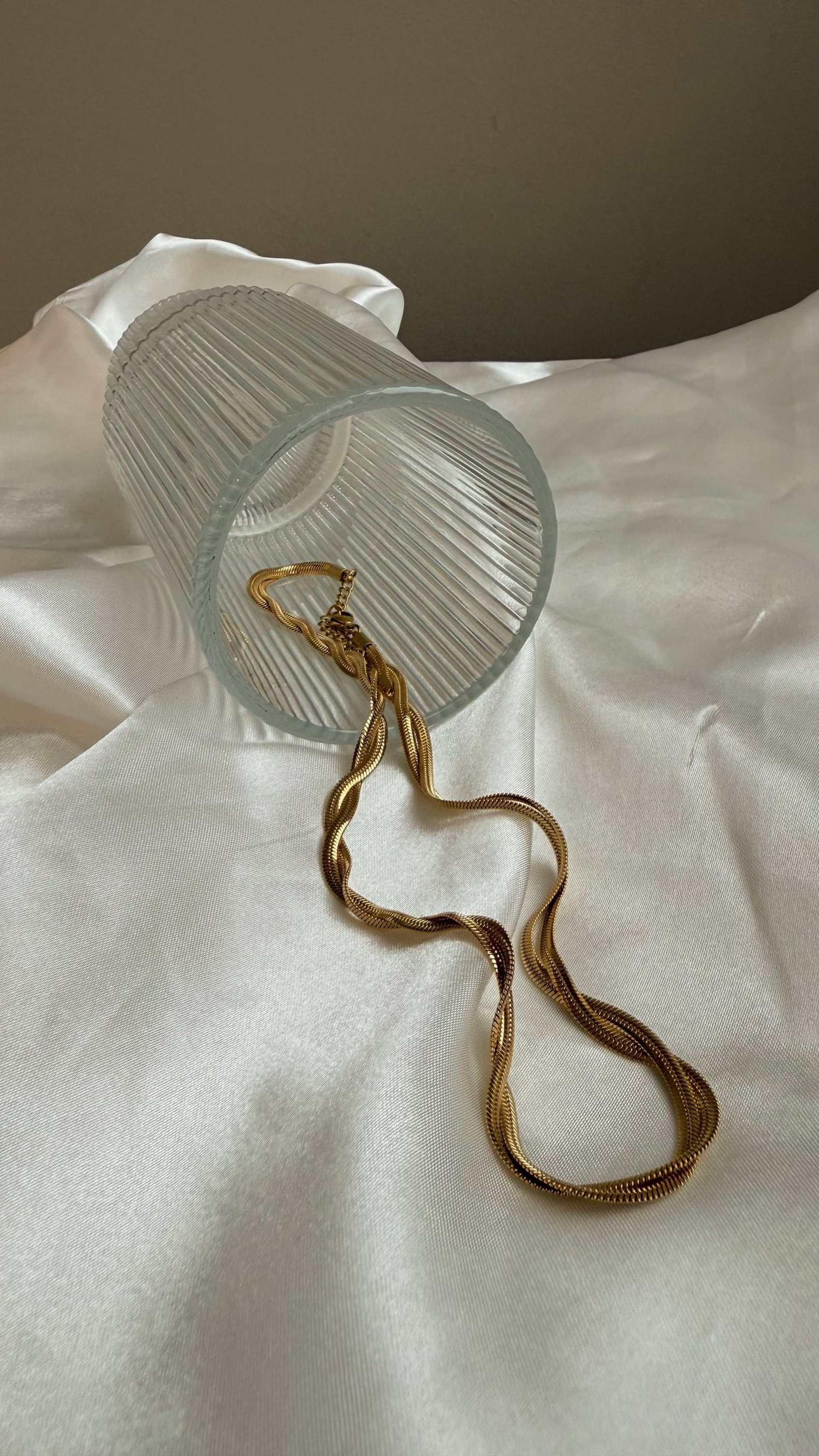 an abstract photo of a curved building with a blue sky in the background