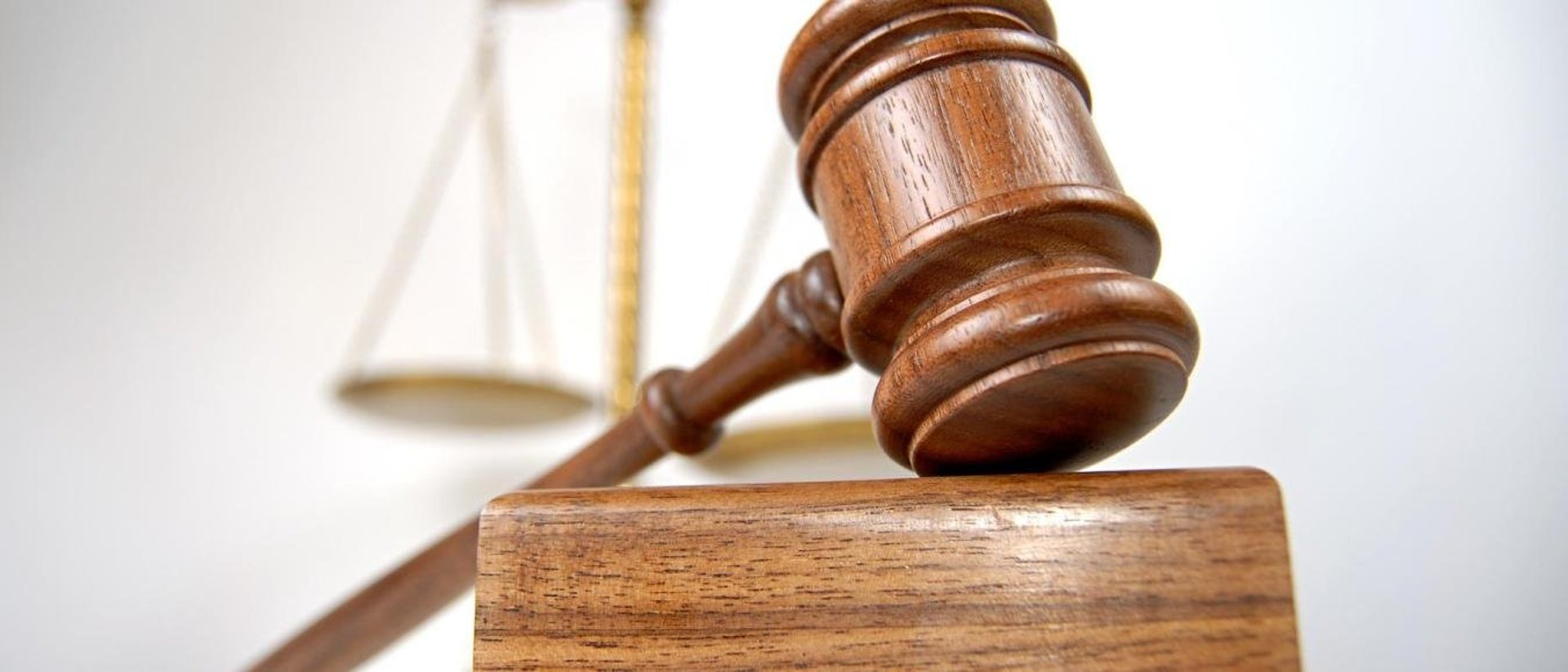 a wooden judge's hammer on top of a table